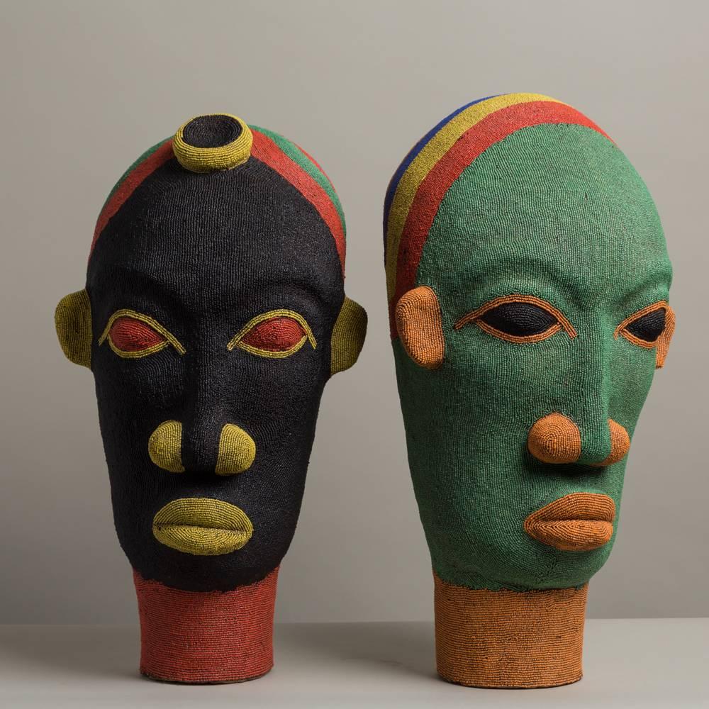 A Pair of Large Late 20th Century Beaded African Head Sculptures. Bought on a recent trip to Morocco, these stunning sculptures have great scale and vibrant colouring. All the work is hand applied on a terracotta maquette.