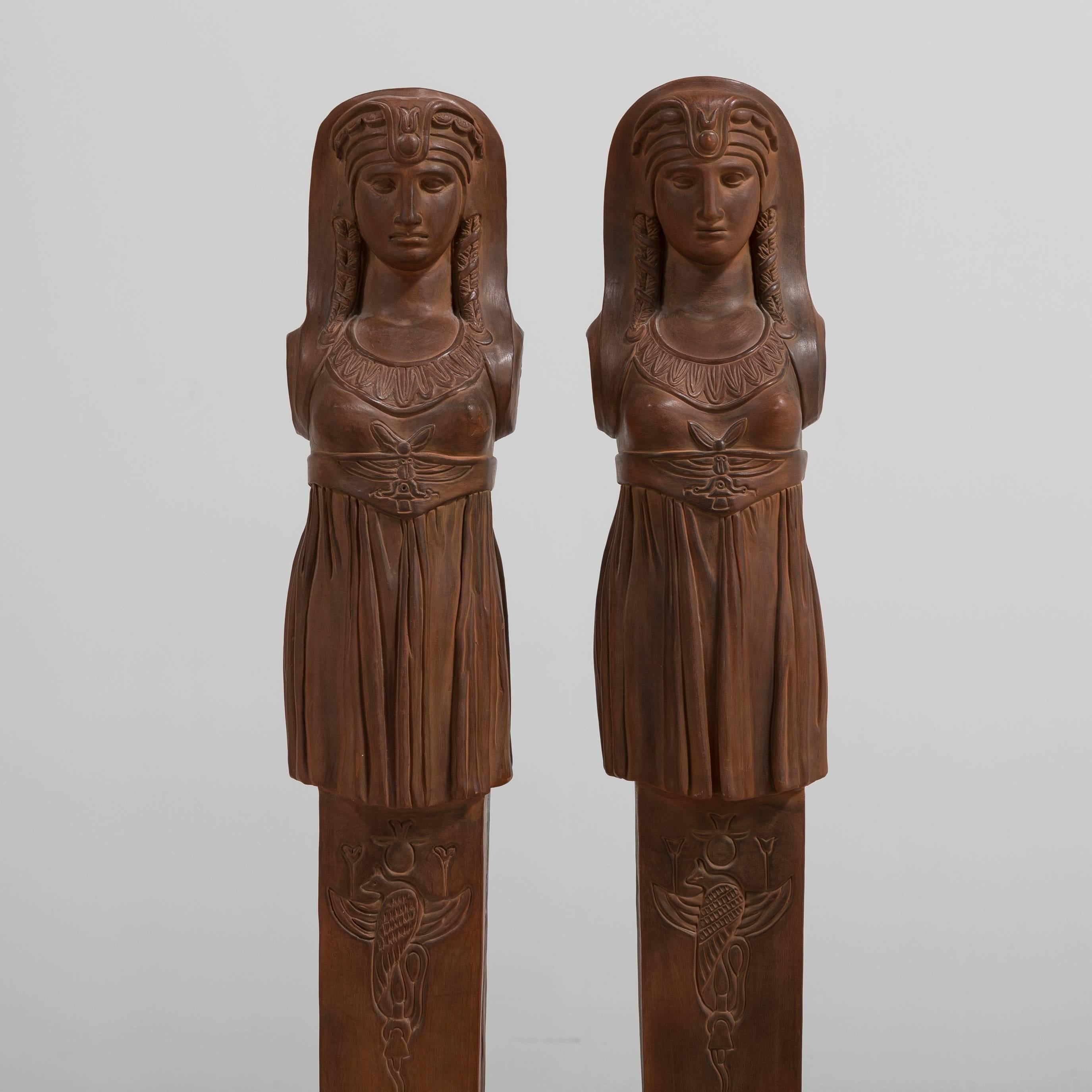 A pair of terracotta term figures, circa 1980
