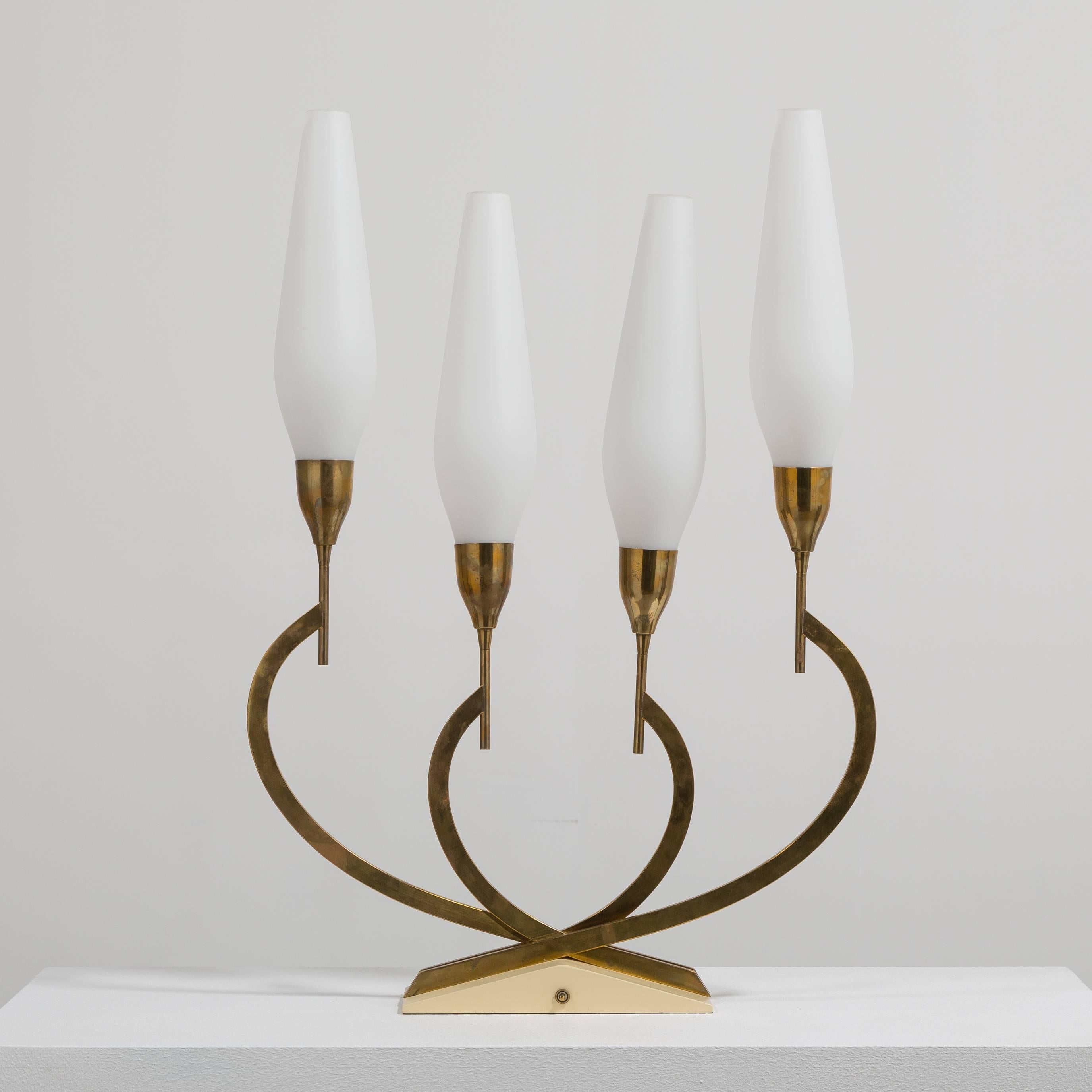 A large single brass table lamp in the manner of Tommy Parzinger with original shades Mid-1950s 
