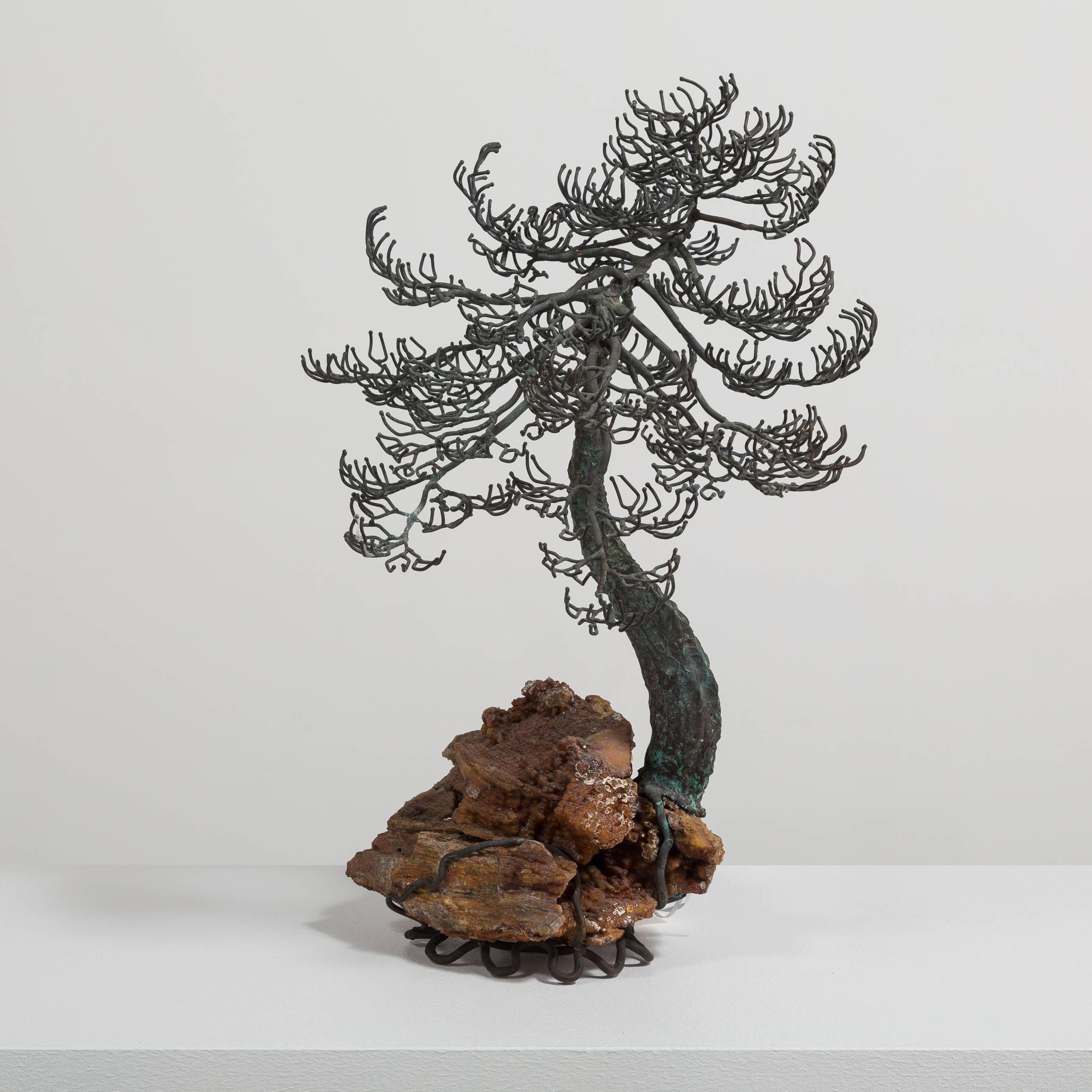 A Superb Bonsai Tree Table Sculpture in Bronze Showing a Gnarled Twisted Tree in Winter Mounted on a Specimen Rocky Base Mid 1960s

Bonsai started in Japan in the 6th century. Bonsai or the art of Pen Jung translates to tray planting. Originally,