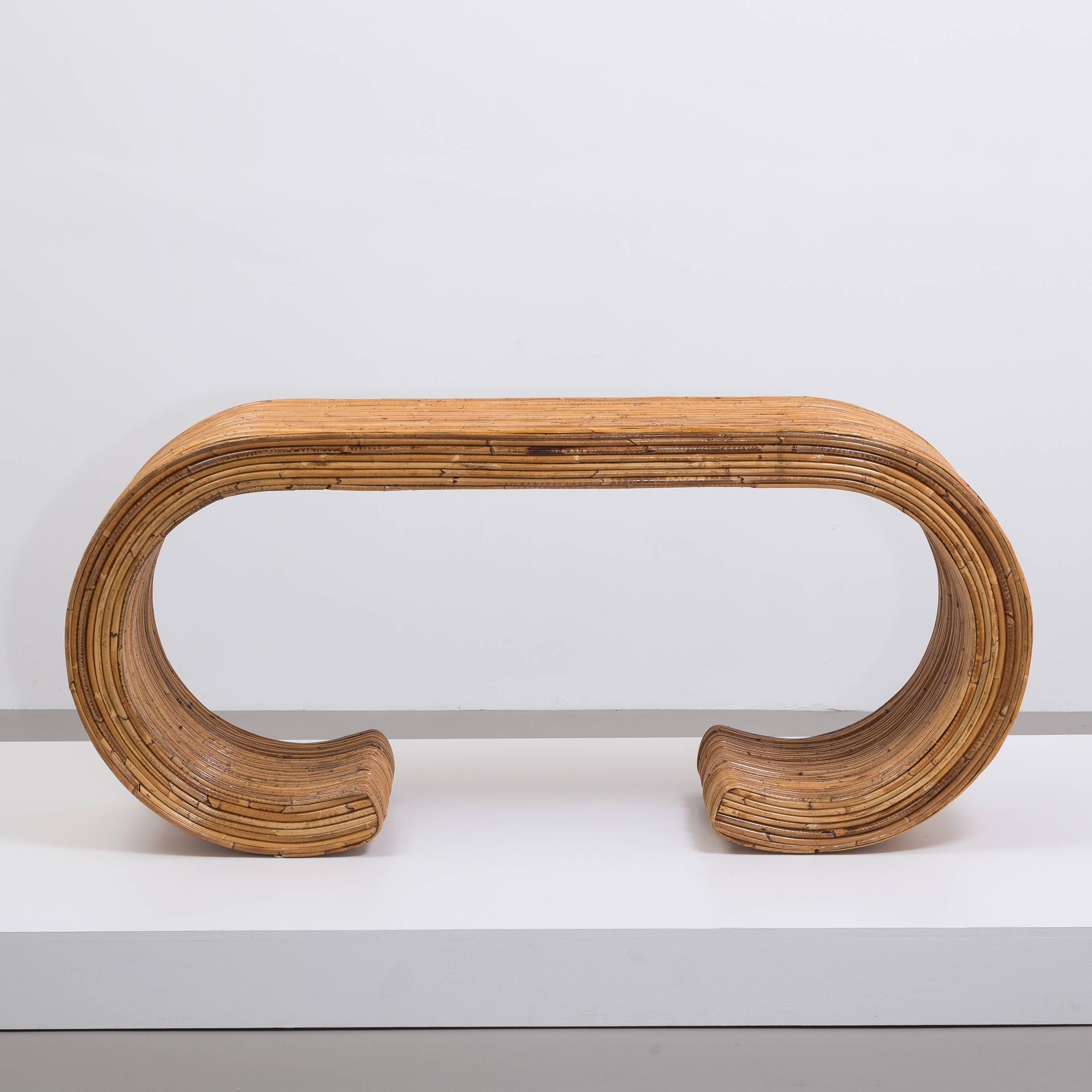 A fabulous pair of bamboo cane wrapped waterfall console tables in the manner of Karl Springer/Gabriella Crespi, 1970s

Price Includes 20% VAT which is removed for items shipped outside the EU.