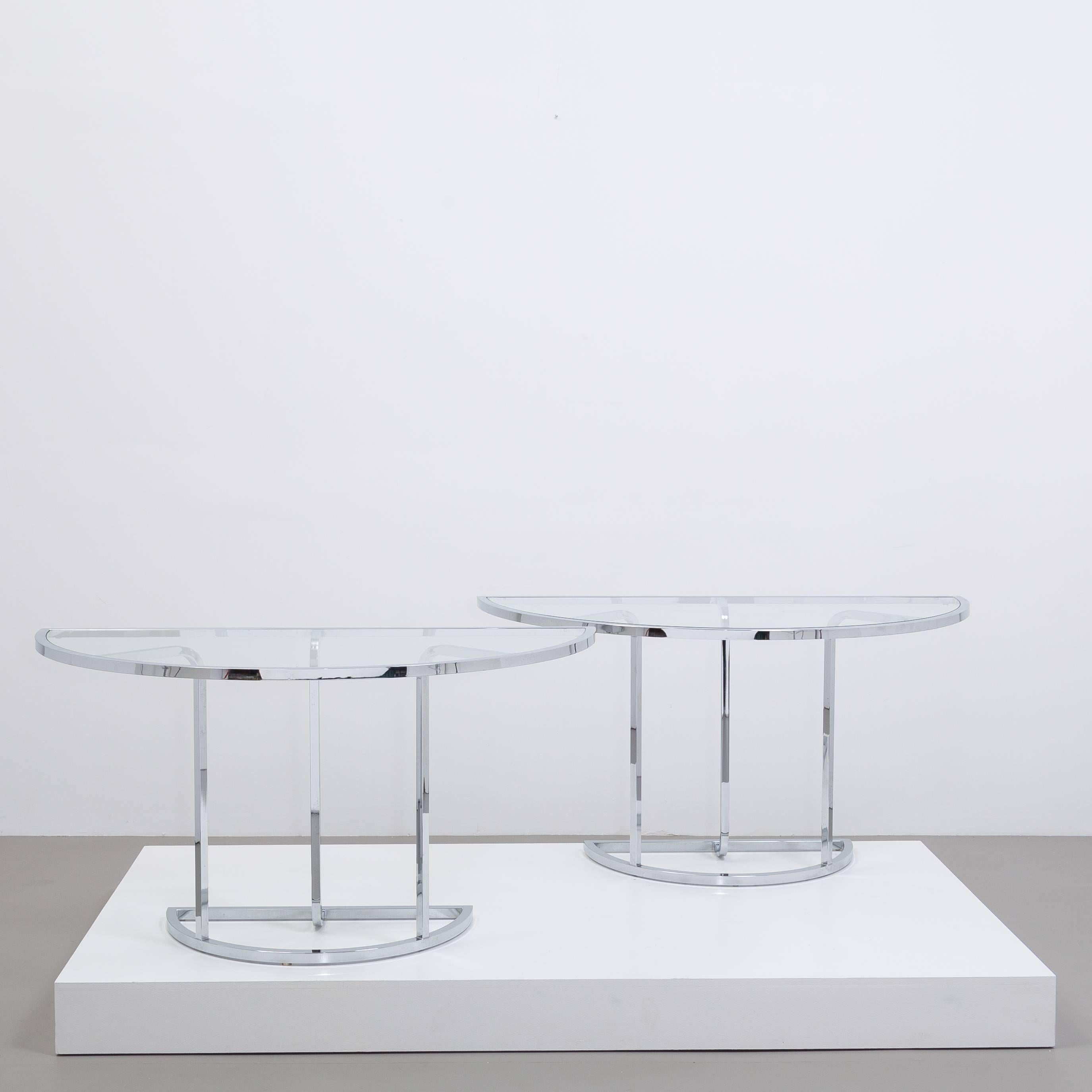 A three-part chromium steel framed demilune ended glass dining table 1970s 
Table parts can be alternatively arranged to be three individual console tables or round table with rectangular console table- see additional images.
