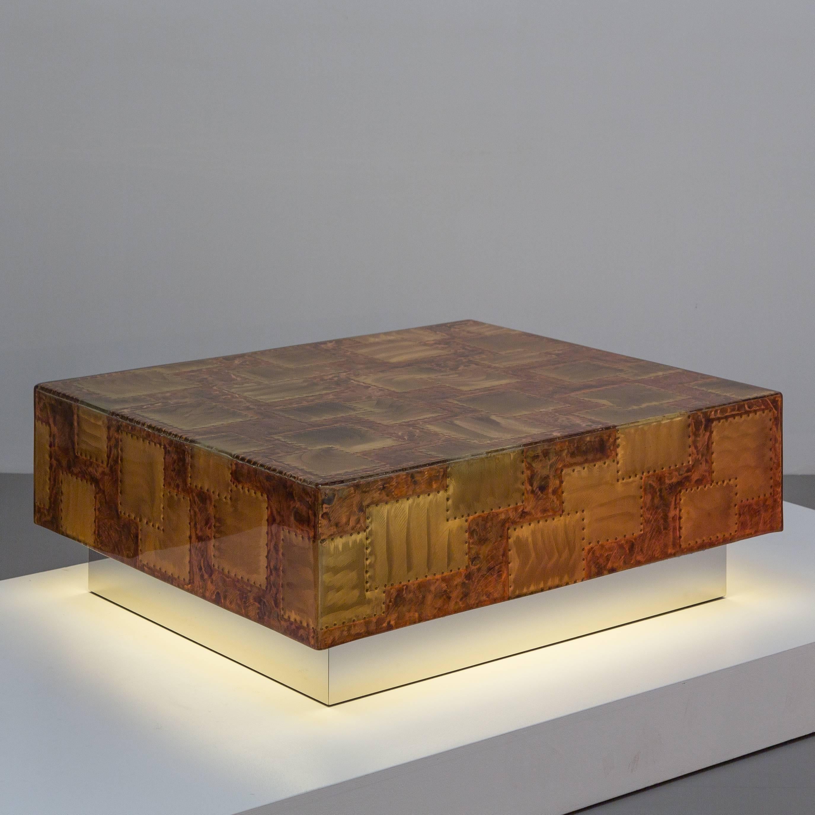 A sensational illuminated lacquered patchwork copper coffee table set on a floating steel base, 1970s.