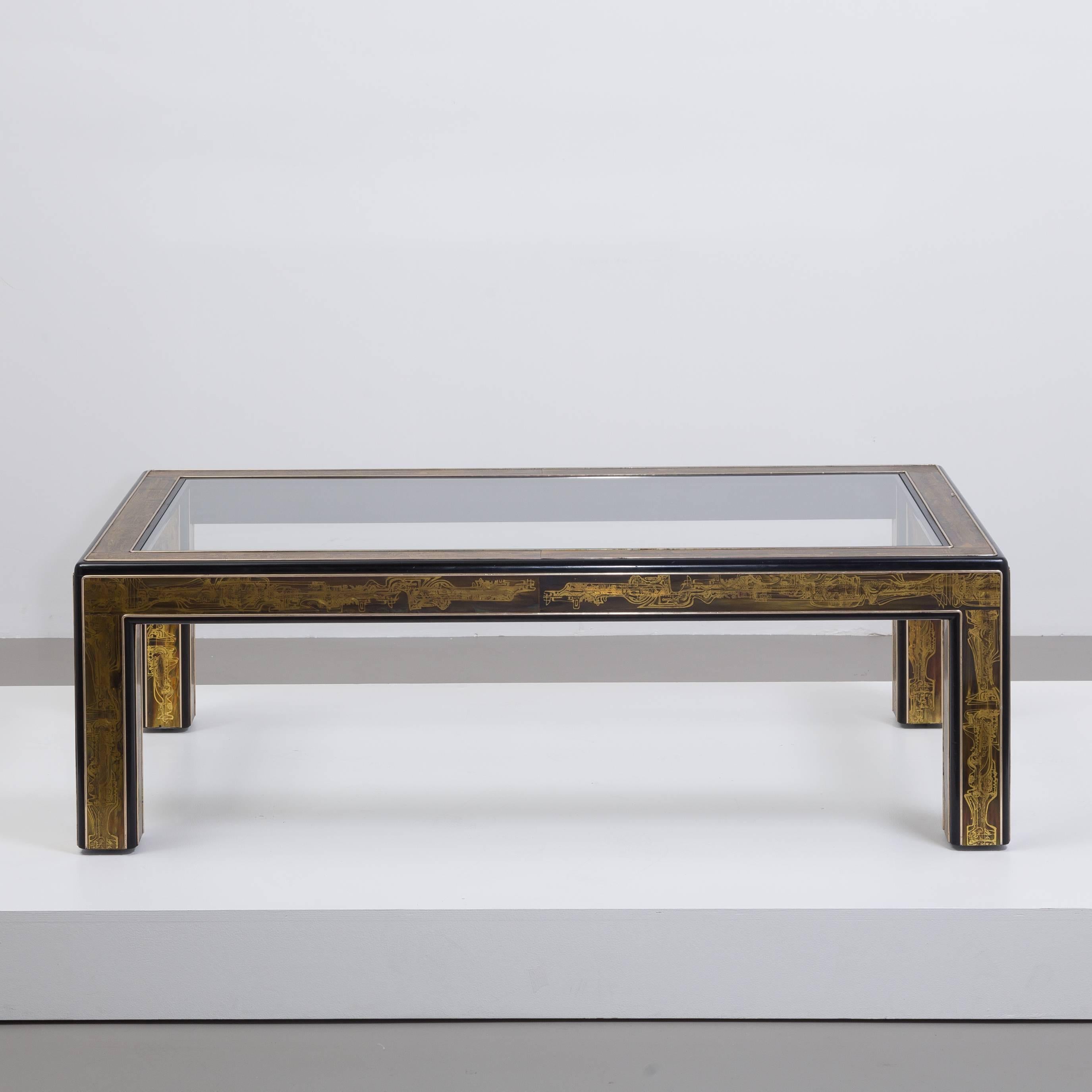 A rectangular Bernhard Rohne designed for Mastercraft acid etched brass and ebonized coffee table with inset glass top, USA, 1970s.

Price includes 20% VAT which is removed for items shipped outside the EU.