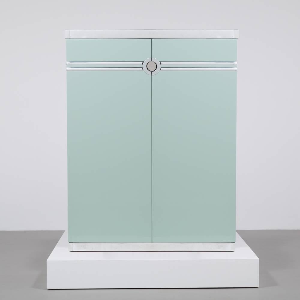 A Pierre Cardin designed Aquamarine High Gloss Lacquered Wardrobe Cabinet France 1970s reconditioned entirely by Talisman 

A Pierre Cardin designed High Gloss Aquamarine Lacquered Two Door Cabinet 1980s signed on original metalwork detail but