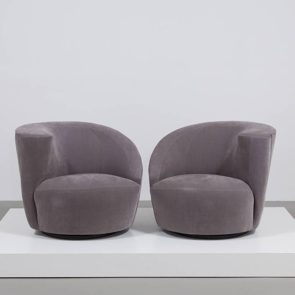 A Pair of Vladimir Kagan (1927-2016) designed Chenille Upholstered Nautilus Swivel Chairs 1990s, Fully Rebuilt and Reupholstered by Talisman 

This pair of handed armchairs are an incredibly comfortable example of Kagans extraordinary work. The