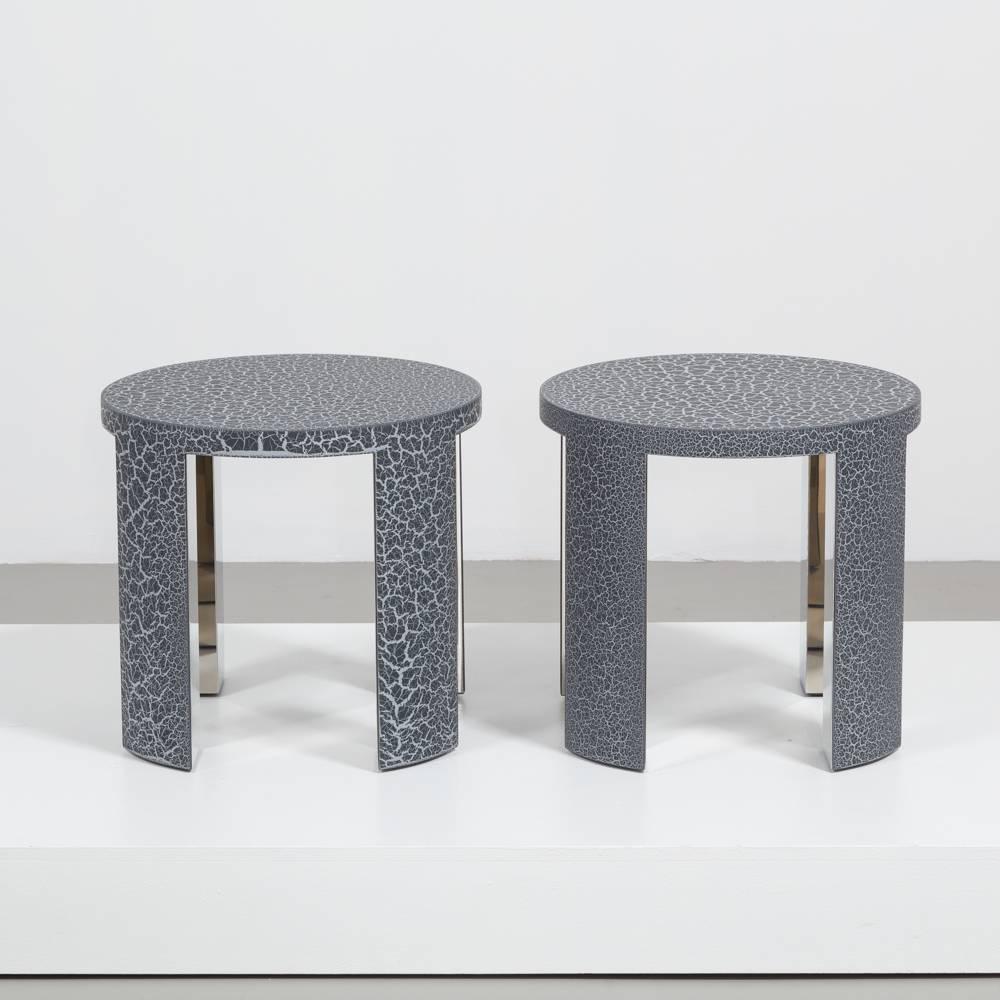 A Pair of Circular Carbon Crackle Side Tables by Talisman Bespoke  

The Talisman team and workshop bring a modern flourish to a traditional technique via a process of layering paint and varnish, resulting in a superb textured surface. This