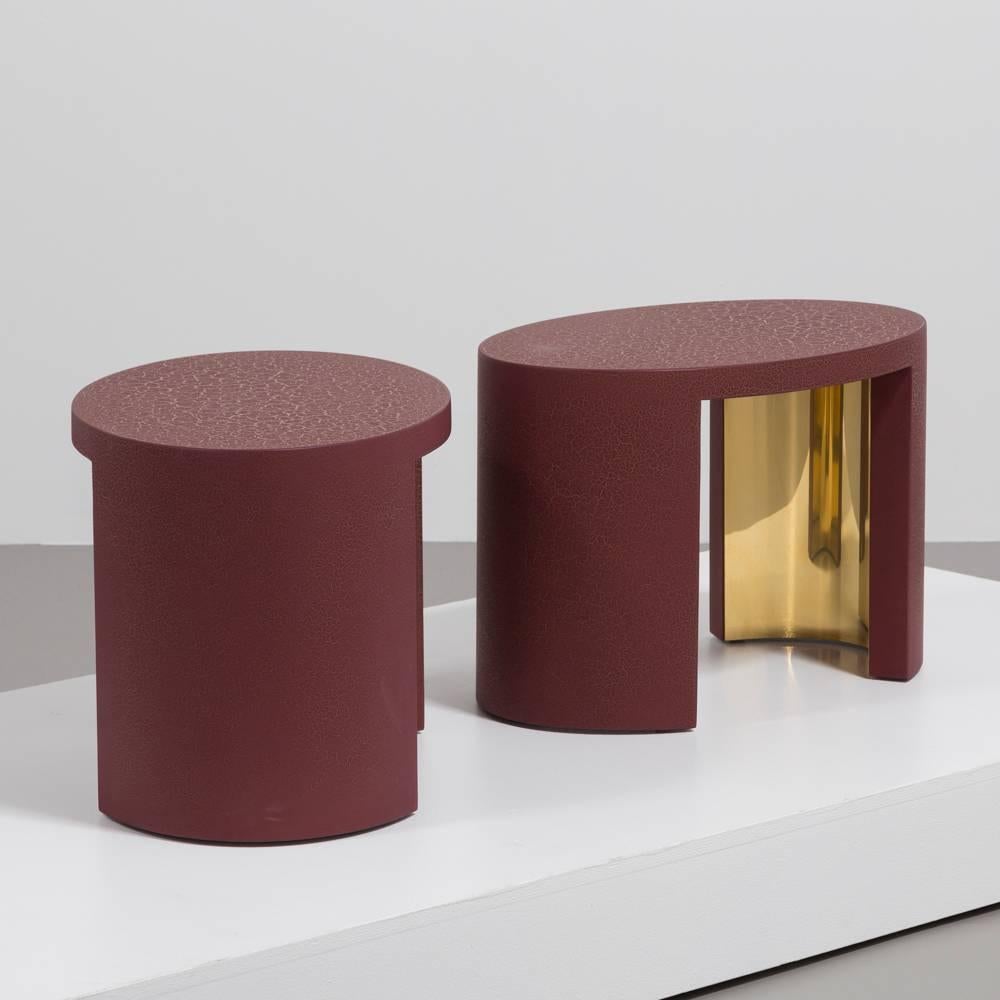 A pair of oval crackle side tables by Talisman Bespoke (burgundy and gold).