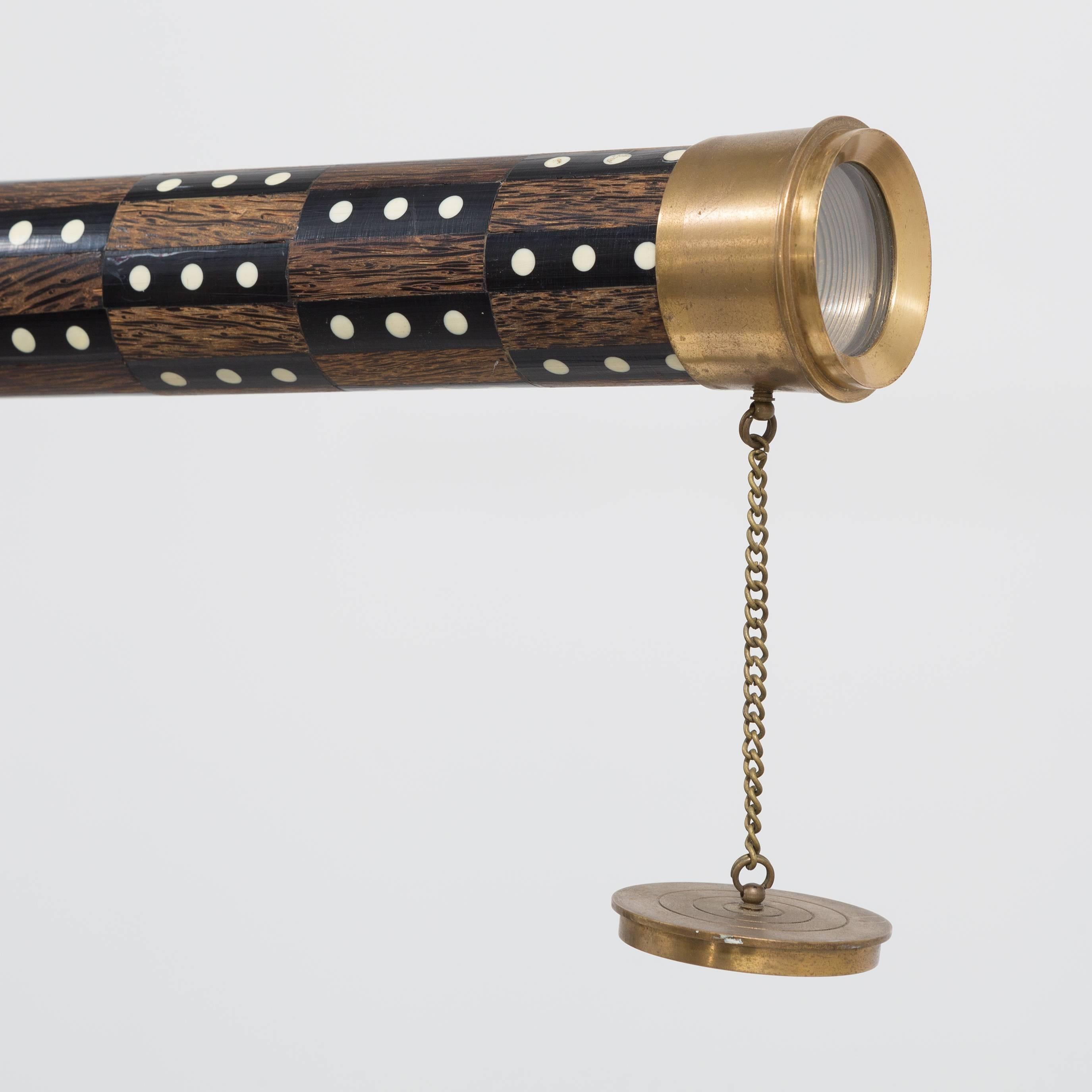 A wooden and brass telescope, 1990s.