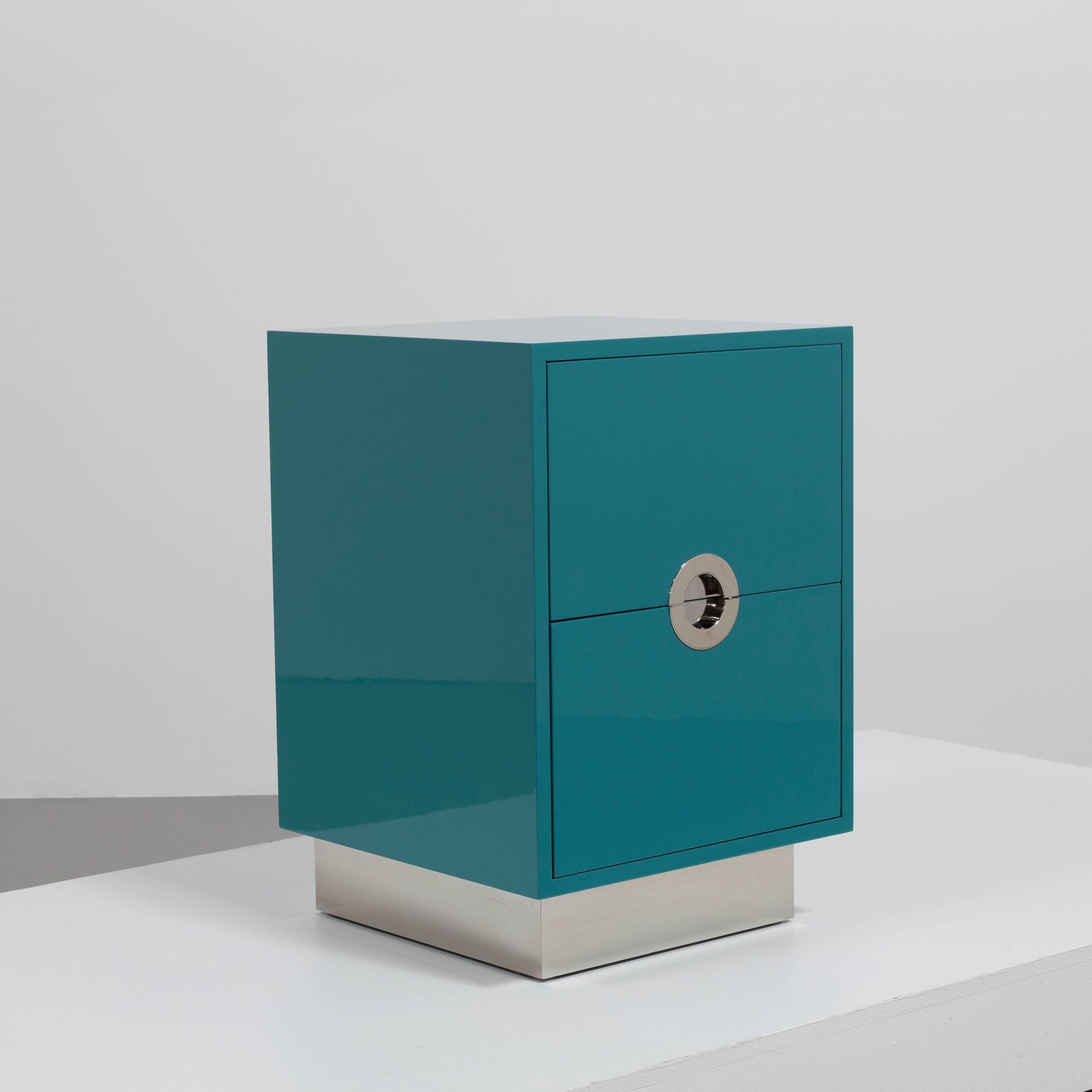 A standard single teal blue lacquered porthole bedside cabinet by Talisman Bespoke

This 1970s inspired design is available in a wide range of lacquer colors (RAL or paint colors can be specified) with either brass or steel metalwork. These