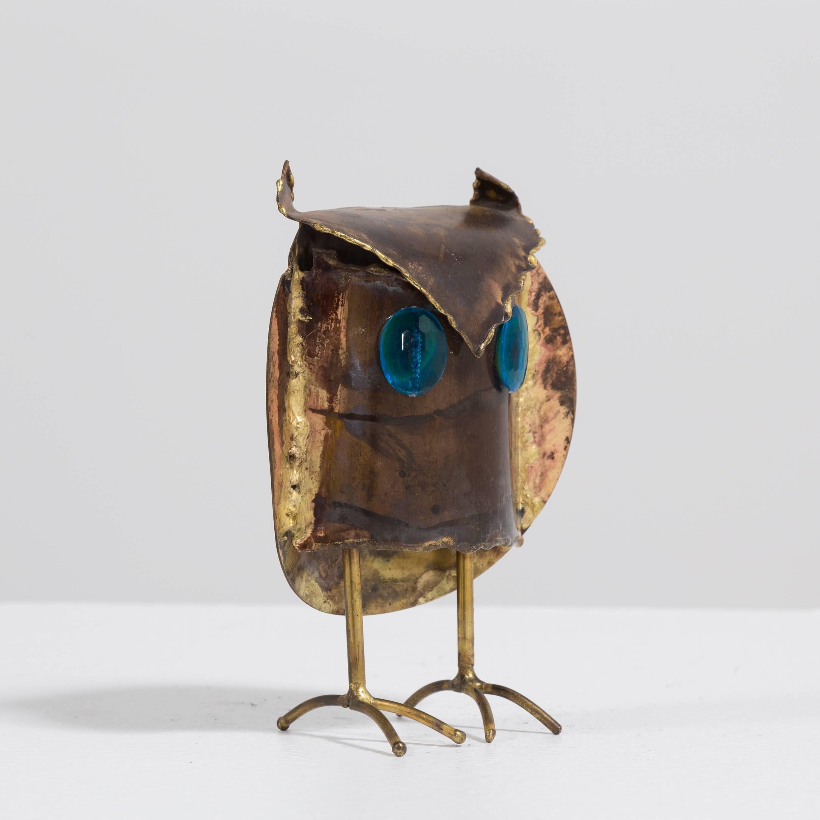 A small Brutalist owl sculpture with blue eyes, signed and dated Rodriguez 73'.