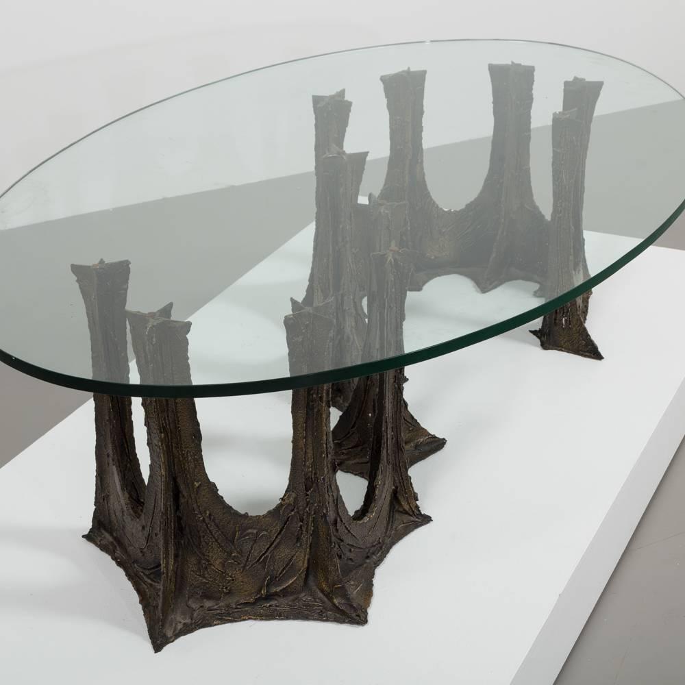 A Paul Evans Studio for Directional bronzed resin over steel stalagmite PE-102 coffee table, USA, 1970 incised signature and date PE67.
 
Base measurements H 46.5cm, W 144 cm, D 55 cm
Glass top 172.5 cm x 106 cm.