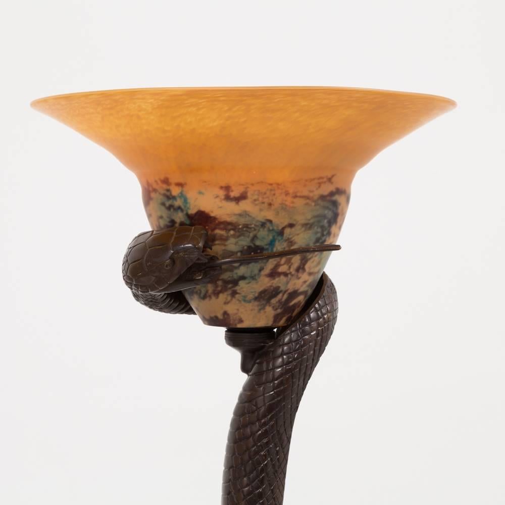 A bronze serpent floor lamp in the manner of Edgar Brandt with Pate de Verre shade, Italian, mid-1970s.