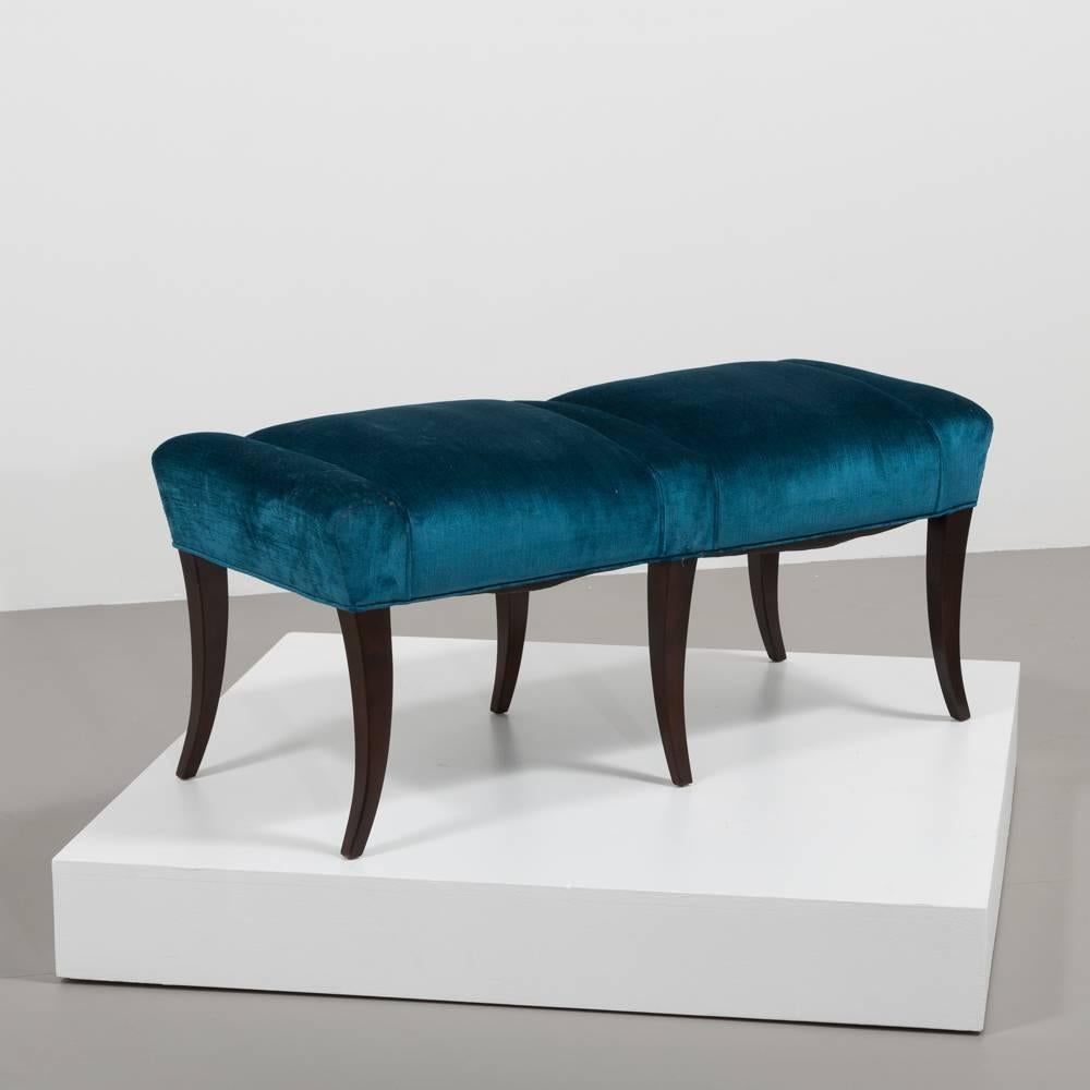 Pair of rich blue velvet upholstered benches in the manner of Parzinger with six flared legs.
      