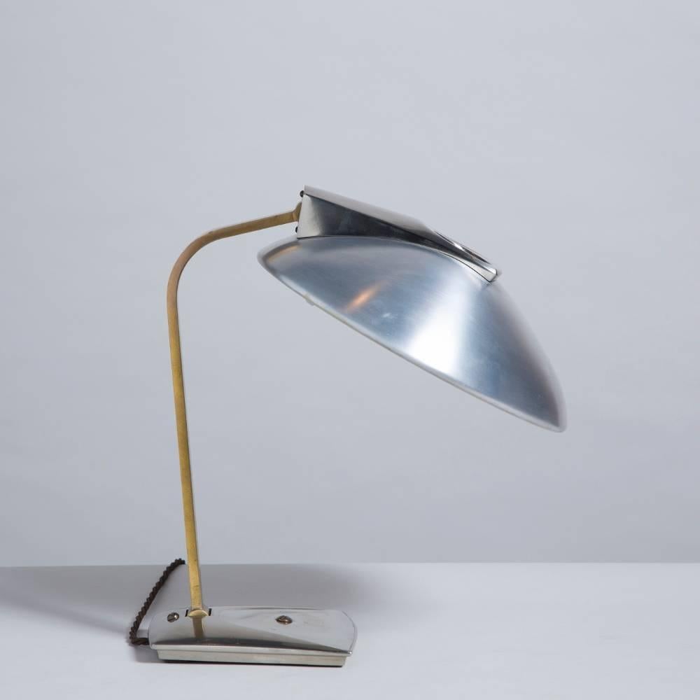 A brass, chrome and aluminium desk lamp by Laurel, 1960s.
Measures: width at widest point 31cm
depth at widest point 44cm

NB: These items are subject to a further discount over and above the trade when exported outside the EU of 20%.