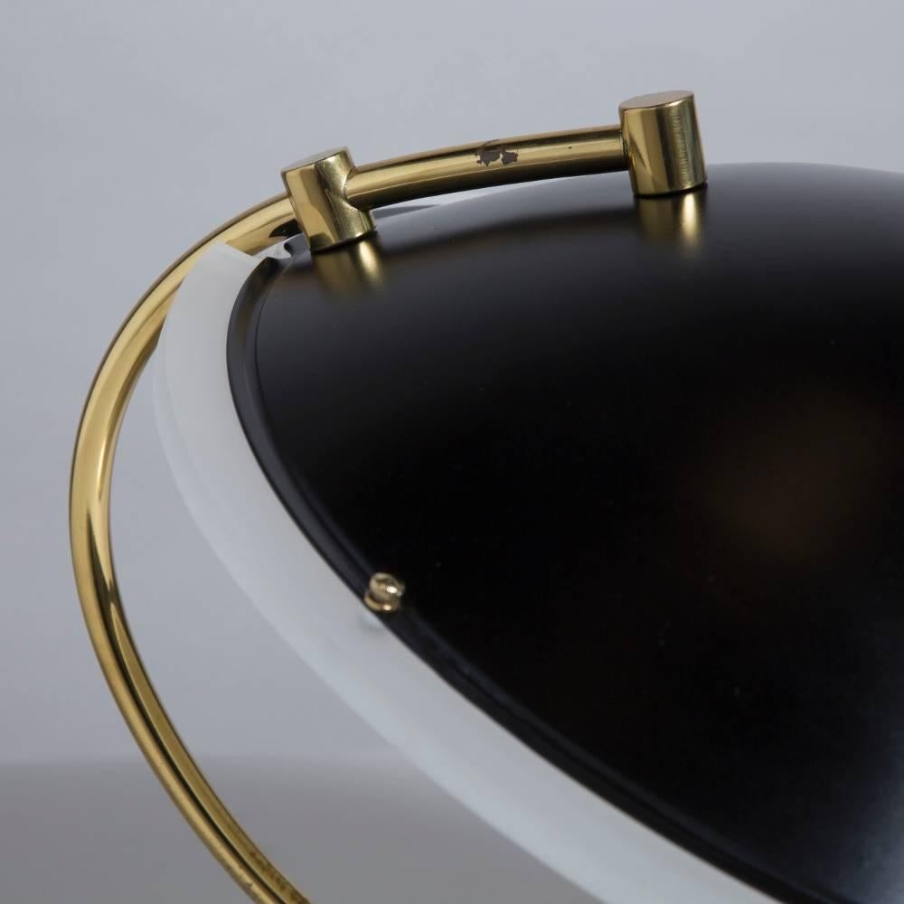 A Bauer designed brass and Lucite desk lamp with black shade 1970s stamped
Measures: Width at widest point 44 cm

NB: These items are subject to a further discount over and above the trade when exported outside the EU of 20%.