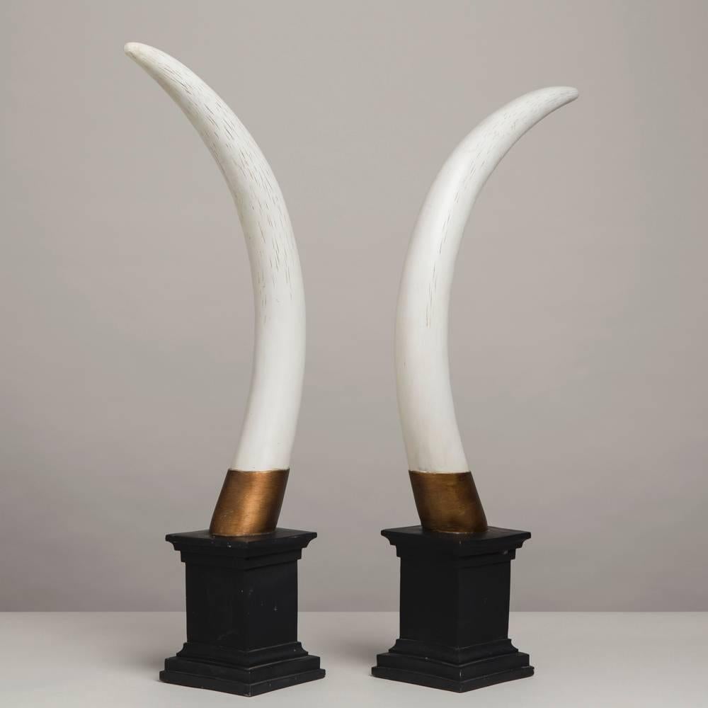 A pair of painted faux tusk table sculptures, 1970s

Smaller tusk height: 77.5 cm
