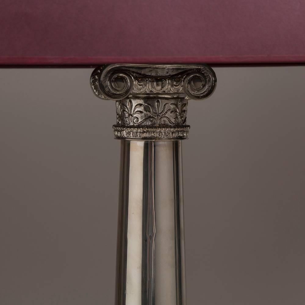 A pair of neoclassical style nickel-plated Doric columned table lamps, 1970s
