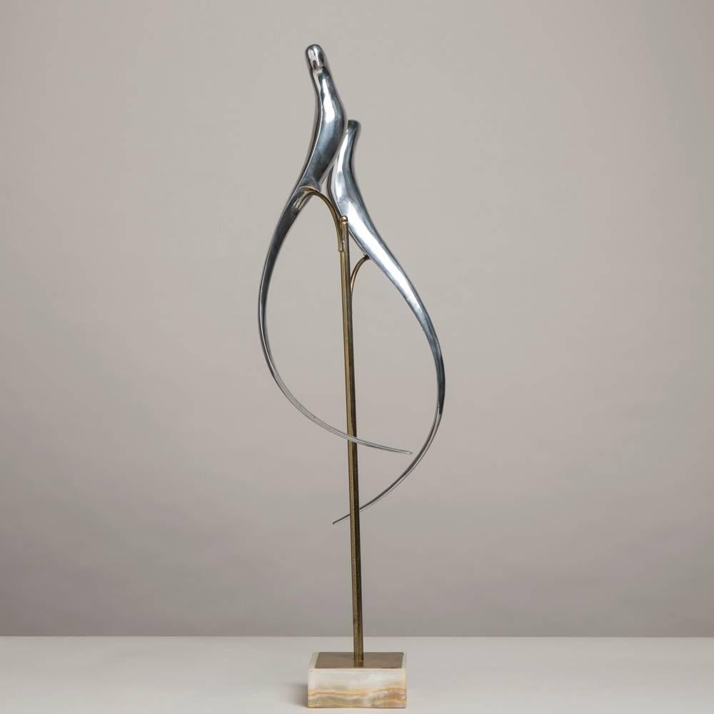 A pair of sculptural polished metal birds by Curtis Jere signed and dated 1977

NB: These items are subject to a further discount over and above the trade when exported outside the EU of 10%.