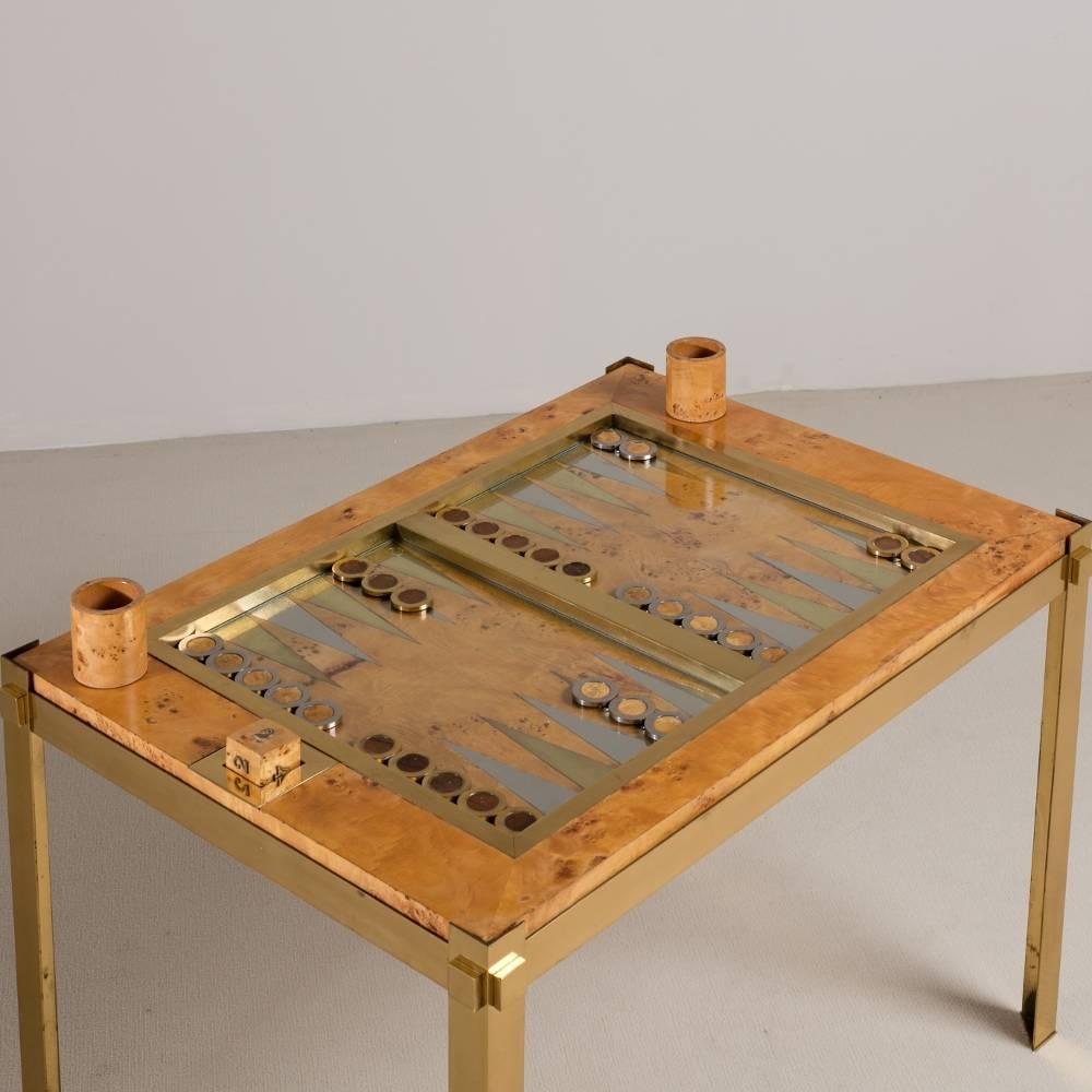 A Tomasso Barbi designed brass, chrome and maple burrwood veneered backgammon table, Italy, 1960s.

Prices include 20% VAT which is removed for items shipped outside the EU.