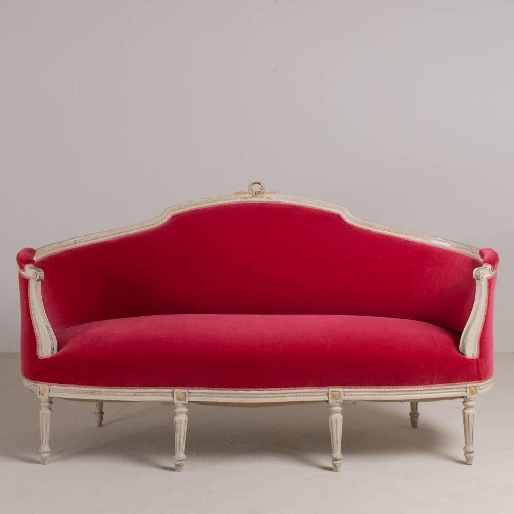 A mid-19th century raspberry mohair velvet upholstered Swedish Rococo style sofa with original paintwork reupholstered by Talisman.