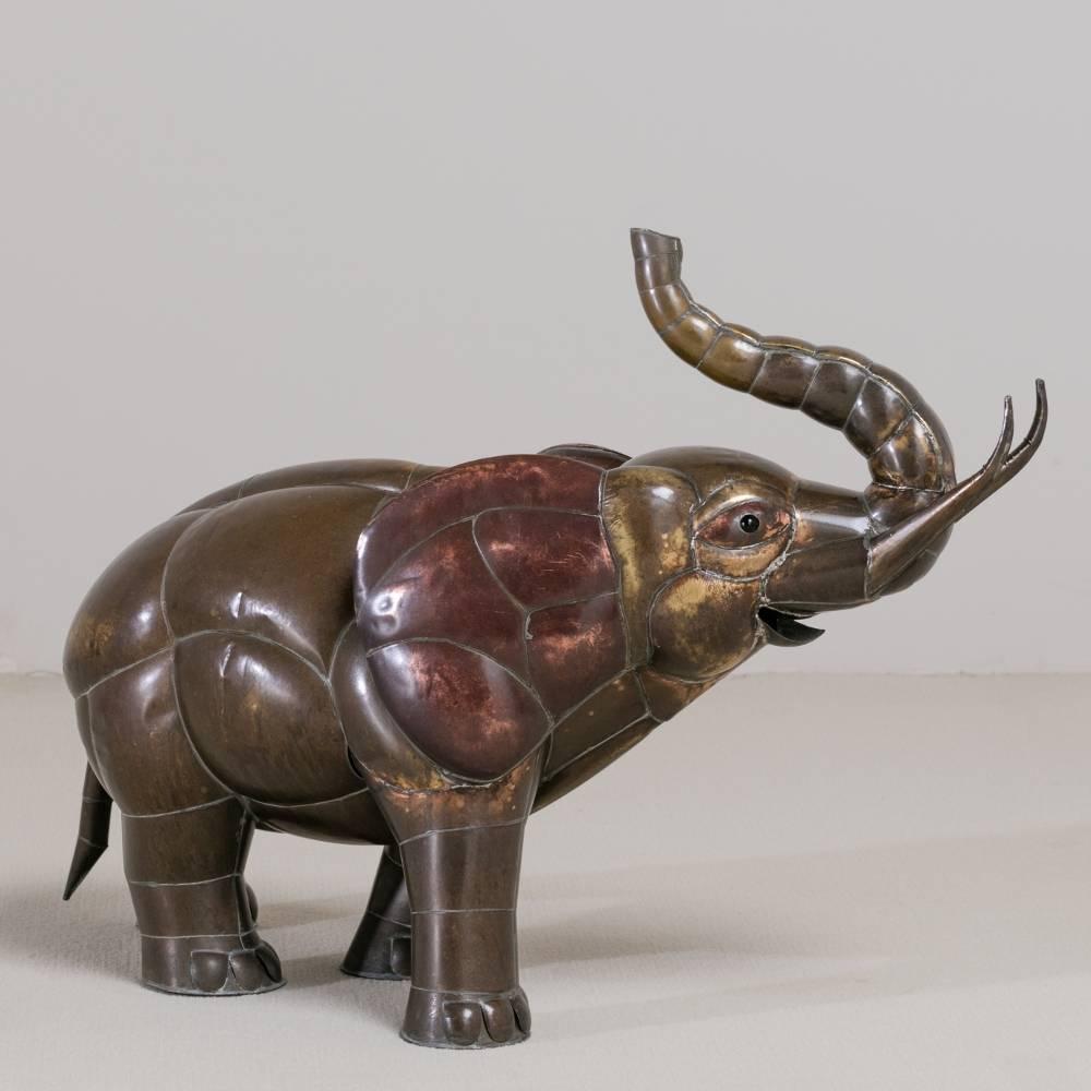A copper elephant sculpture by Sergio Bustamante

Whilst Bustamante's works initially focused on painting and papier-mâché, his talents led, in the mid-1970s, to the creation of sculptures in wood and brass, many of which are reflecting animal