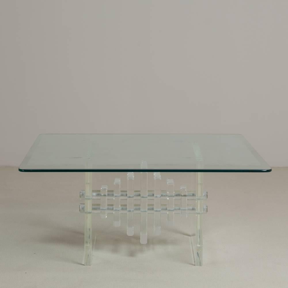 A square slab ended Lucite coffee table with bevelled edge glass top 1970s.

Prices include 20% VAT which is removed for items shipped outside the EU.
