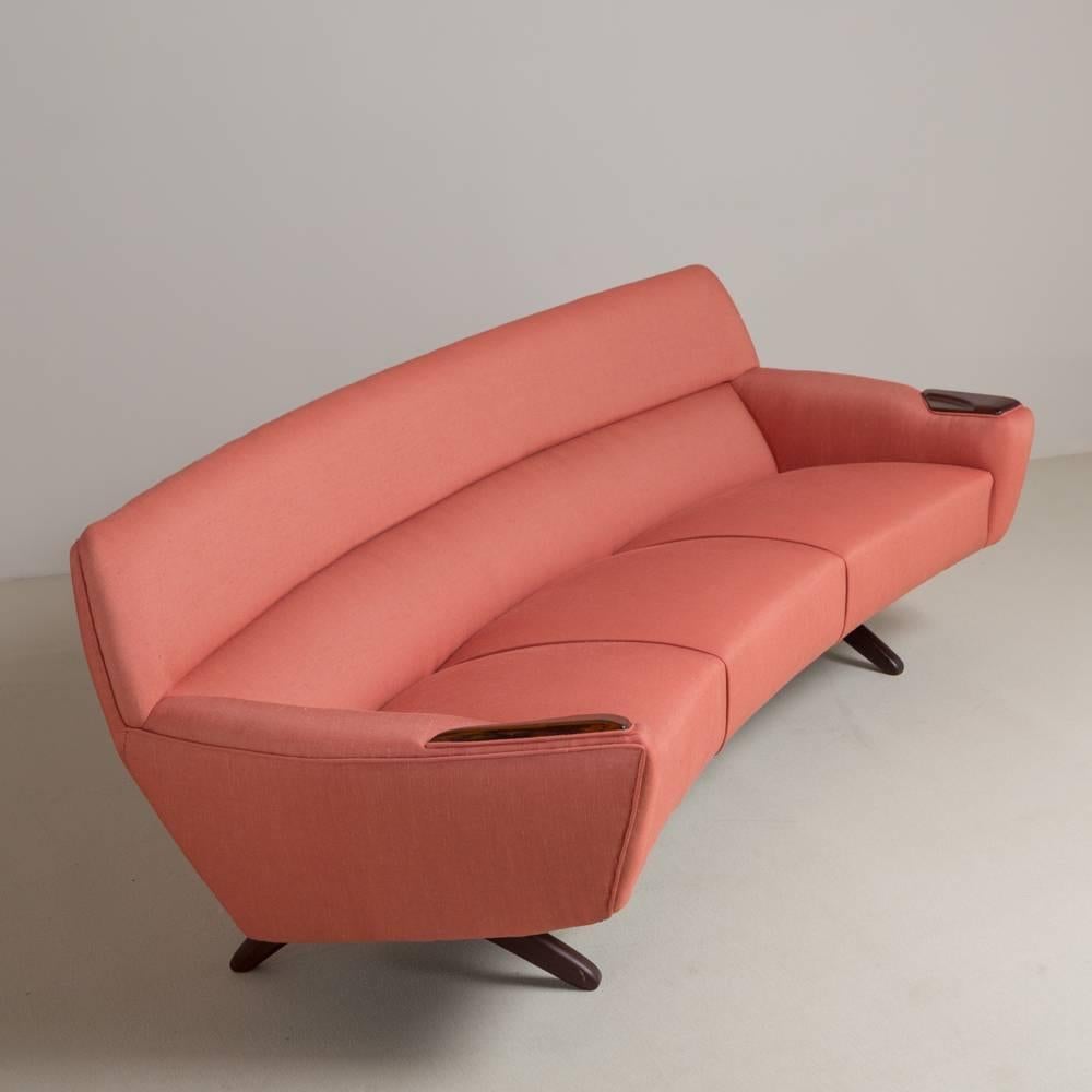 A rare coral pink upholstered sofa designed by Leif Hansen for Kronen Denmark, circa 1964 reupholstered by Talisman.

Prices include 20% VAT which is removed for items shipped outside the EU.