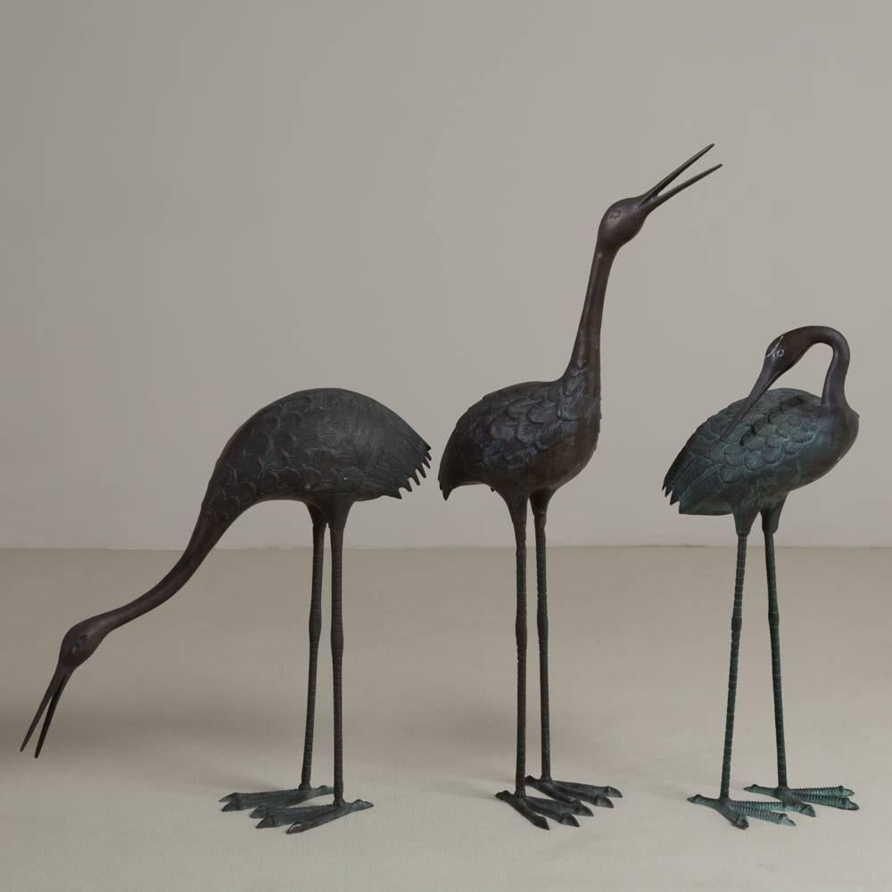 A set of three bronze crane sculptures, 1970s. Could be placed as either tabletop or floor standing.