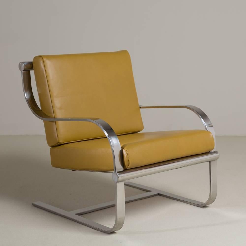 A chromium steel cantilevered armchair and ottoman stool, 1970s.

Stool measures 68.5 cm x 49 cm x 38 cm high.