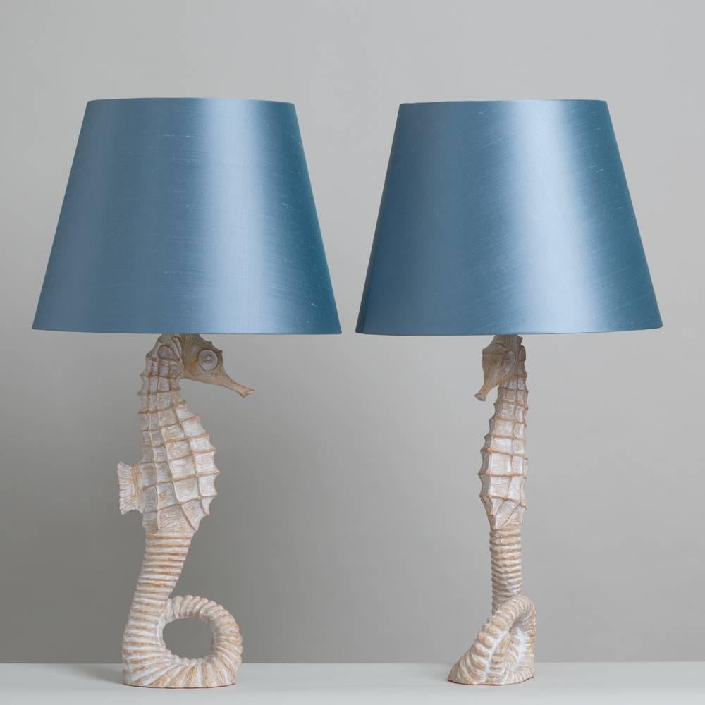 A pair of late 20th century faux bois seahorse table lamps.