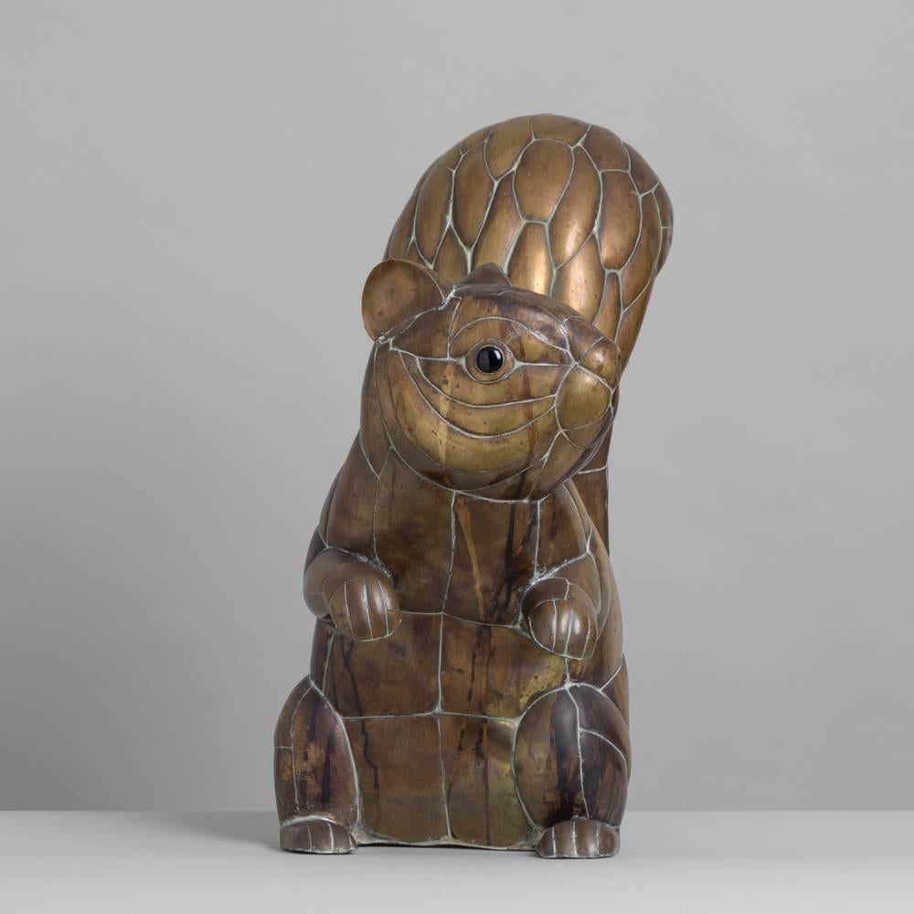 A copper and brass squirrel by Sergio Bustamante, 1970s, 11 in edition of 100 plaque.

Sergio Bustamante is a Mexican Artist and sculptor. He began with paintings and papier mache figures, inaugurating the first exhibit of his works at the Galeria