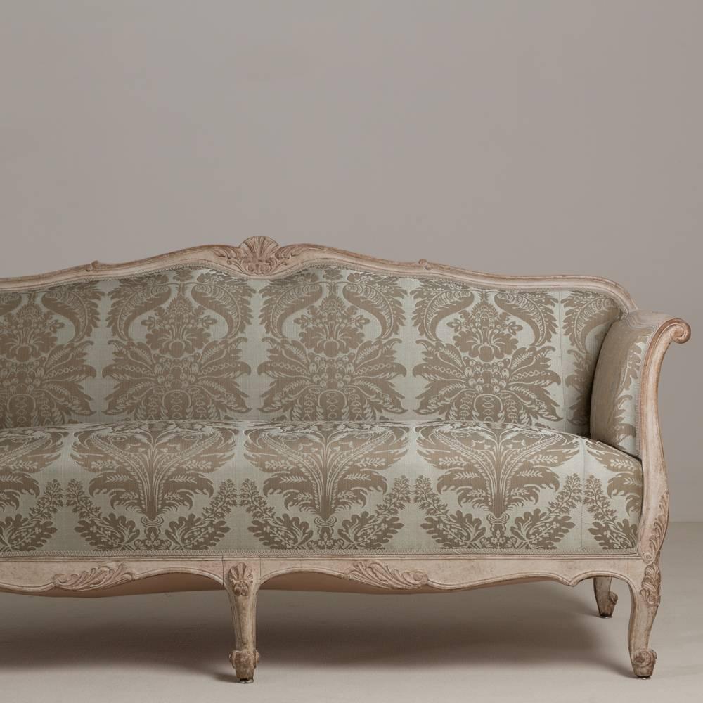 A 19th century Damask upholstered Swedish sofa circa 1880 with original paintwork, fully reupholstered by Talisman.
