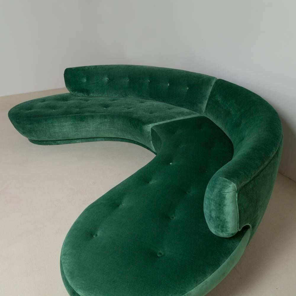 A large semi circular green velvet two-part sectional sofa 1960s fully reupholstered by Talisman.

Prices include 20% VAT which is removed for items shipped outside the EU.