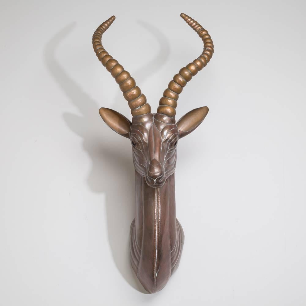 A sensational copper wall-mounted antelope by Sergio Bustamante, Mexico, 1970s.

Sergio Bustamante is a Mexican Artist and sculptor. He began with paintings and papier mache figures, inaugurating the first exhibit of his works at the Galeria