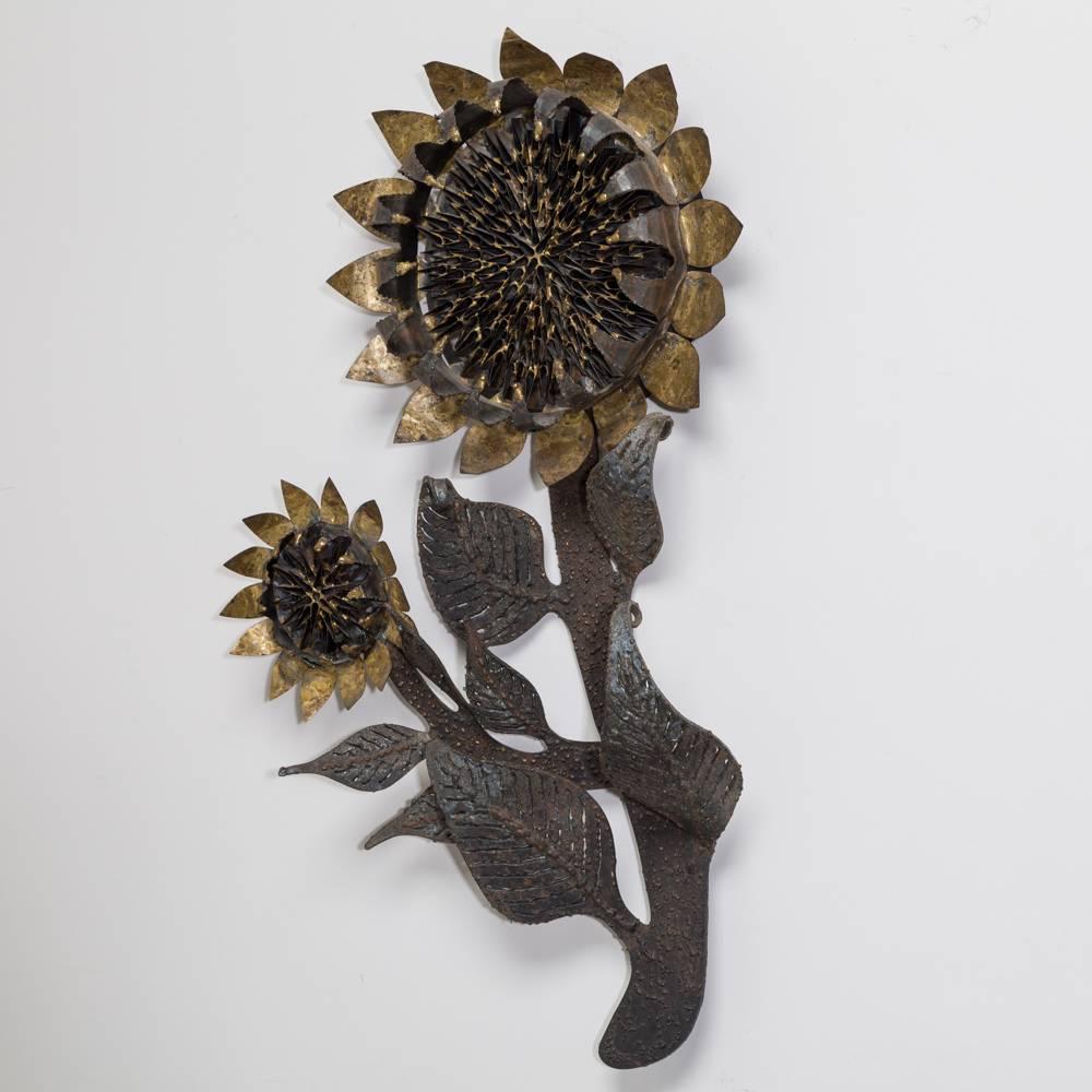 An early rare sunflower metal wall sculpture by Curtis Jere signed and dated, 1967.