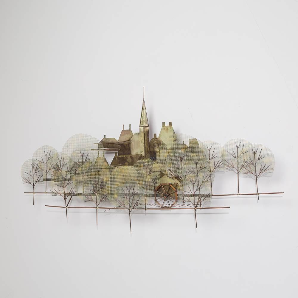 A Curtis Jere metal wall sculpture of a town scene with church steeple, USA, signed.

NB: These items are subject to a further discount over and above the trade when exported outside the EU of 10%