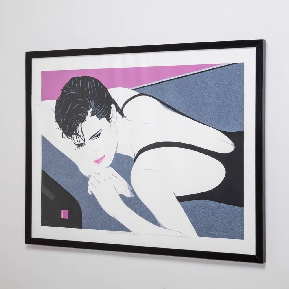 A framed landscape deco style print of a woman, 1980s.