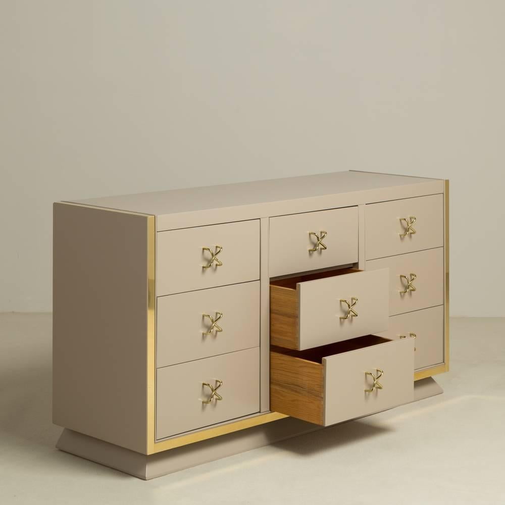 A unique nine-drawer satin lacquered cabinet with 'X' shaped brass pulls and brass mounts, 1950s, Talisman edition. Fully restored by Talisman and reinterpreted from original execution.
