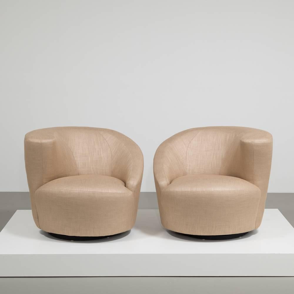 A pair of Vladimir Kagan designed glazed linen upholstered nautilus swivel chairs, late 1980s. Fully rebuilt and reupholstered by Talisman.