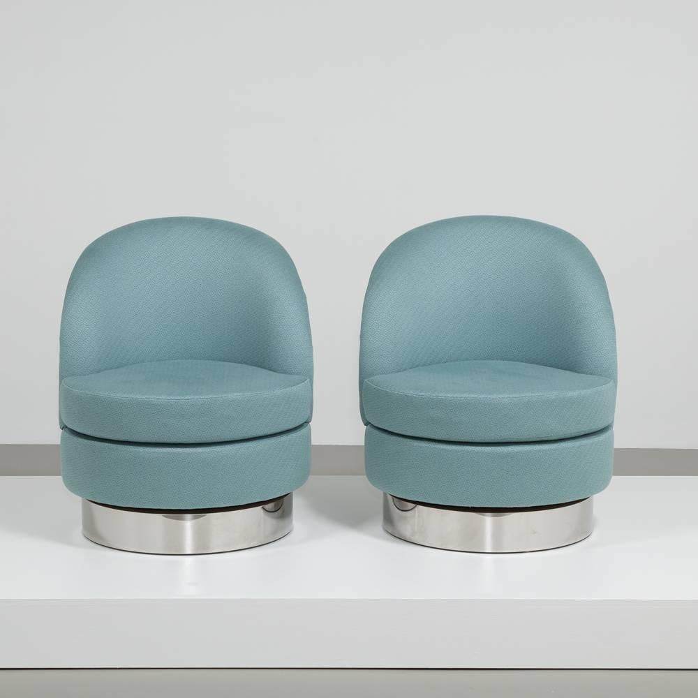 A standard pair of upholstered swivel chairs on steel bases by Talisman Bespoke.

This compact but comfortable swivel chair is a carefully refined addition to the Talisman Bespoke collection, inspired by the shapes of various 20th century designs.