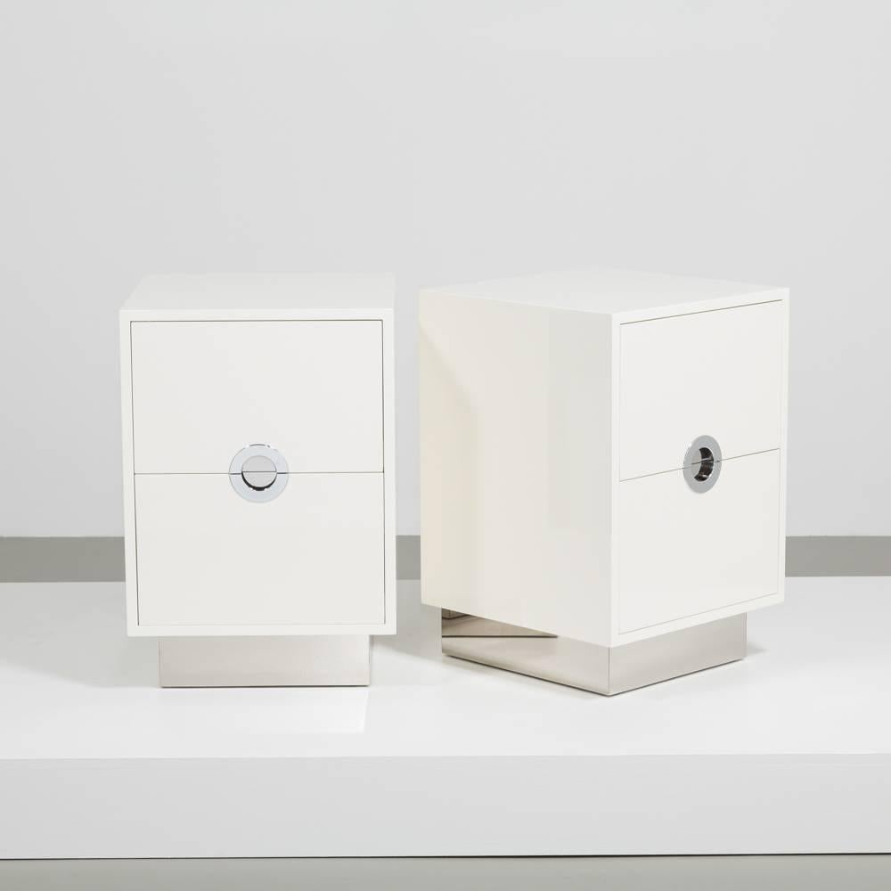 A standard pair of Ivory lacquered porthole bedside cabinets on steel bases by Talisman Bespoke. 

 This 1970s inspired design is available in a wide range of lacquer colors (RAL/paint colors can be specified) with either brass or steel metalwork.