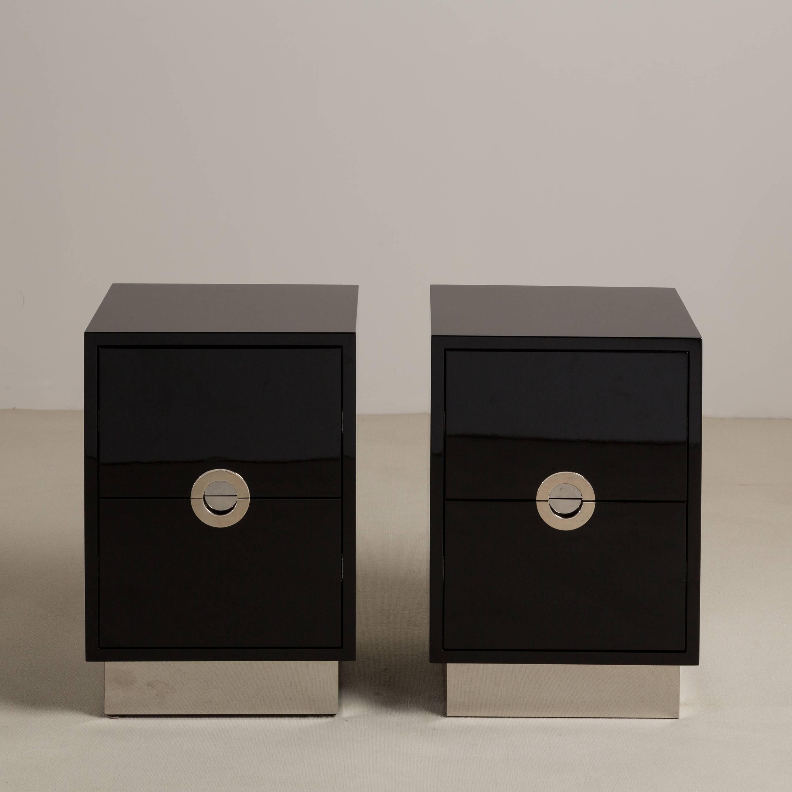 A standard pair of jet black lacquered porthole bedside cabinets by Talisman Bespoke

This 1970s inspired design is available in a wide range of lacquer colours (Ral/paint colours can be specified) with either brass or steel metalwork. These bedside