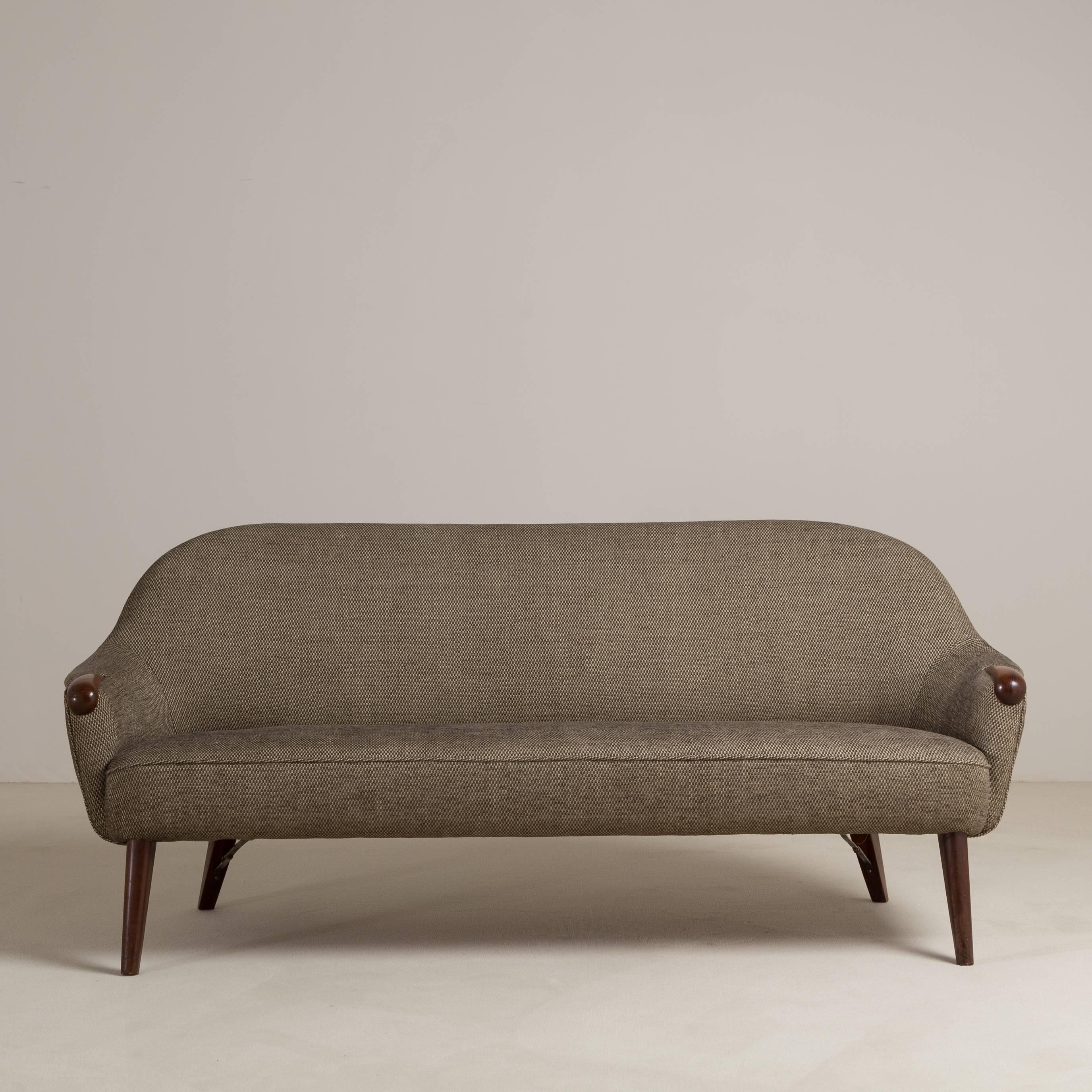 A chic Danish upholstered sofa by Kurt Ostervig, 1960s. Fully reupholstered by Talisman. 

Prices include 20% VAT which is removed for items shipped outside the EU.