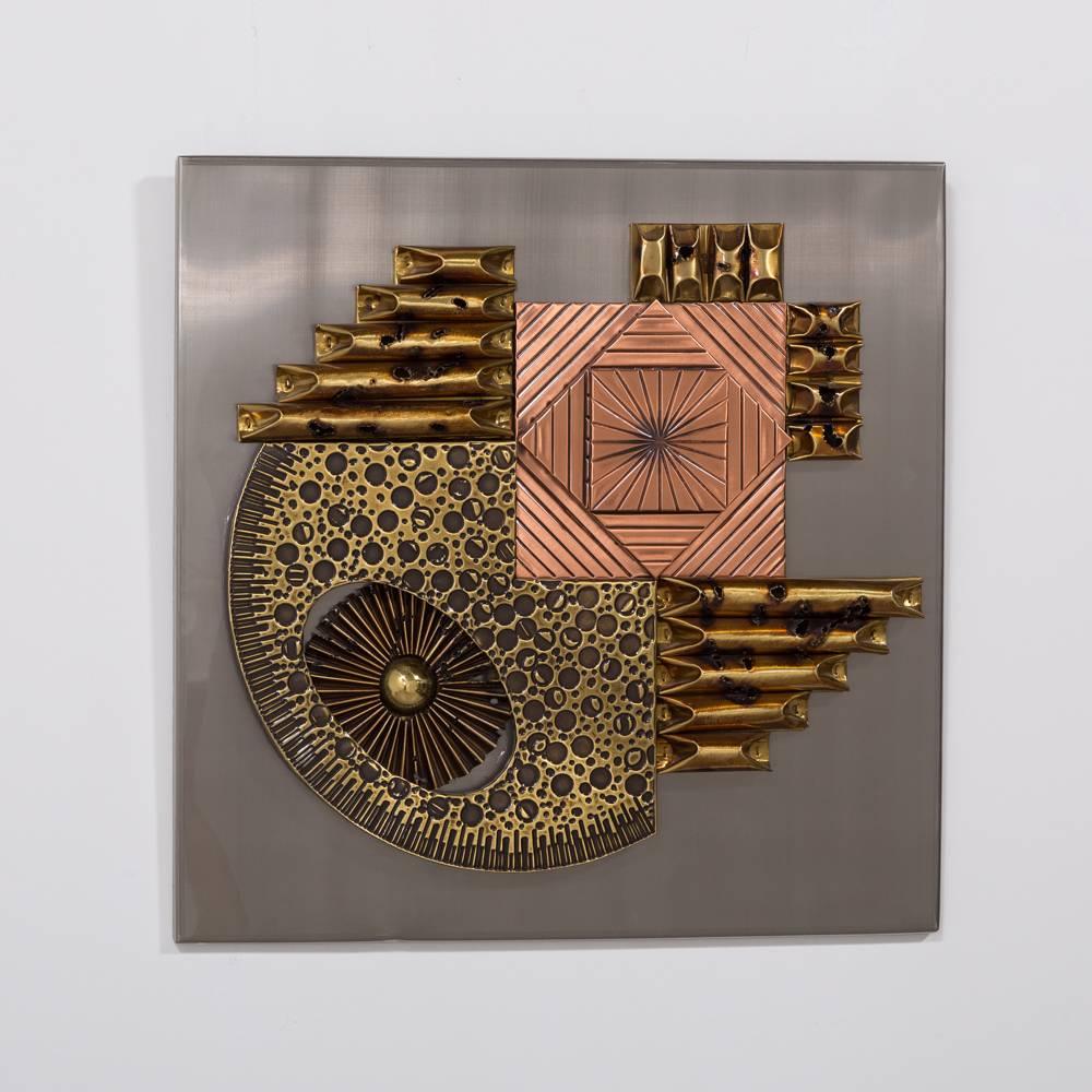 A square Brutalist metal wall panel sculpture, 1970s

The panel is heavily influenced by the work of Paul Vanders and of the same period of design as he was working. Embossed and textured patinated metals on wood.
