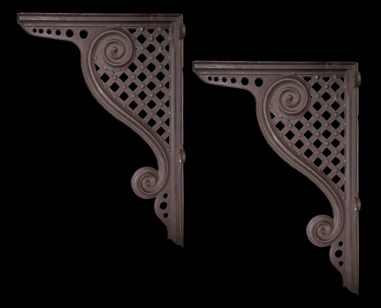 Cast Iron Awning Brackets, American, c. 1875. Originally from a train station canopy. 3 Pairs are available, sold as pairs only.