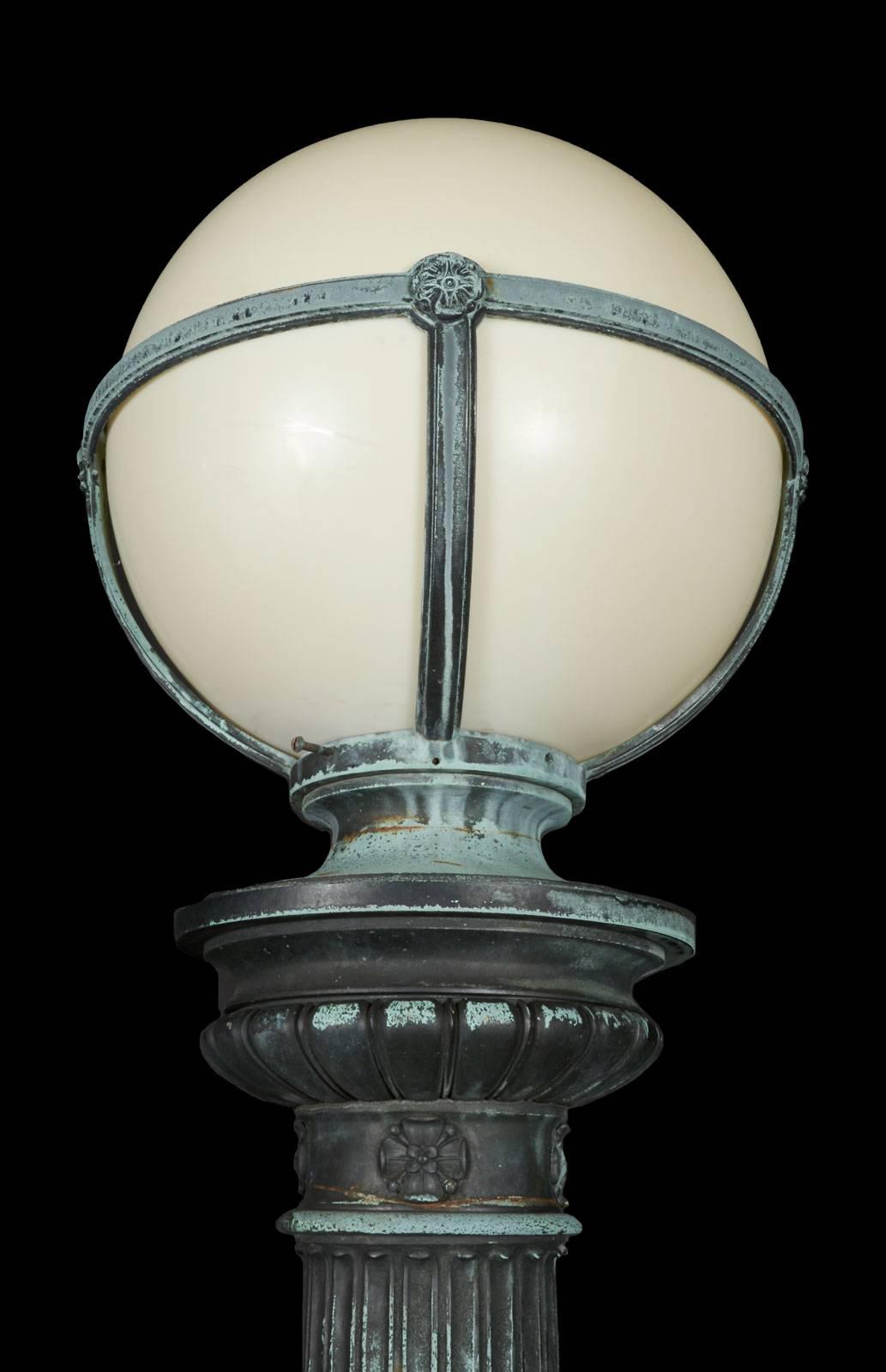 Pair of cast bronze entry lights with a fabulous patina and detail, circa 1910, perhaps the best we've ever seen. Perfect size for interior as well as exterior use.
