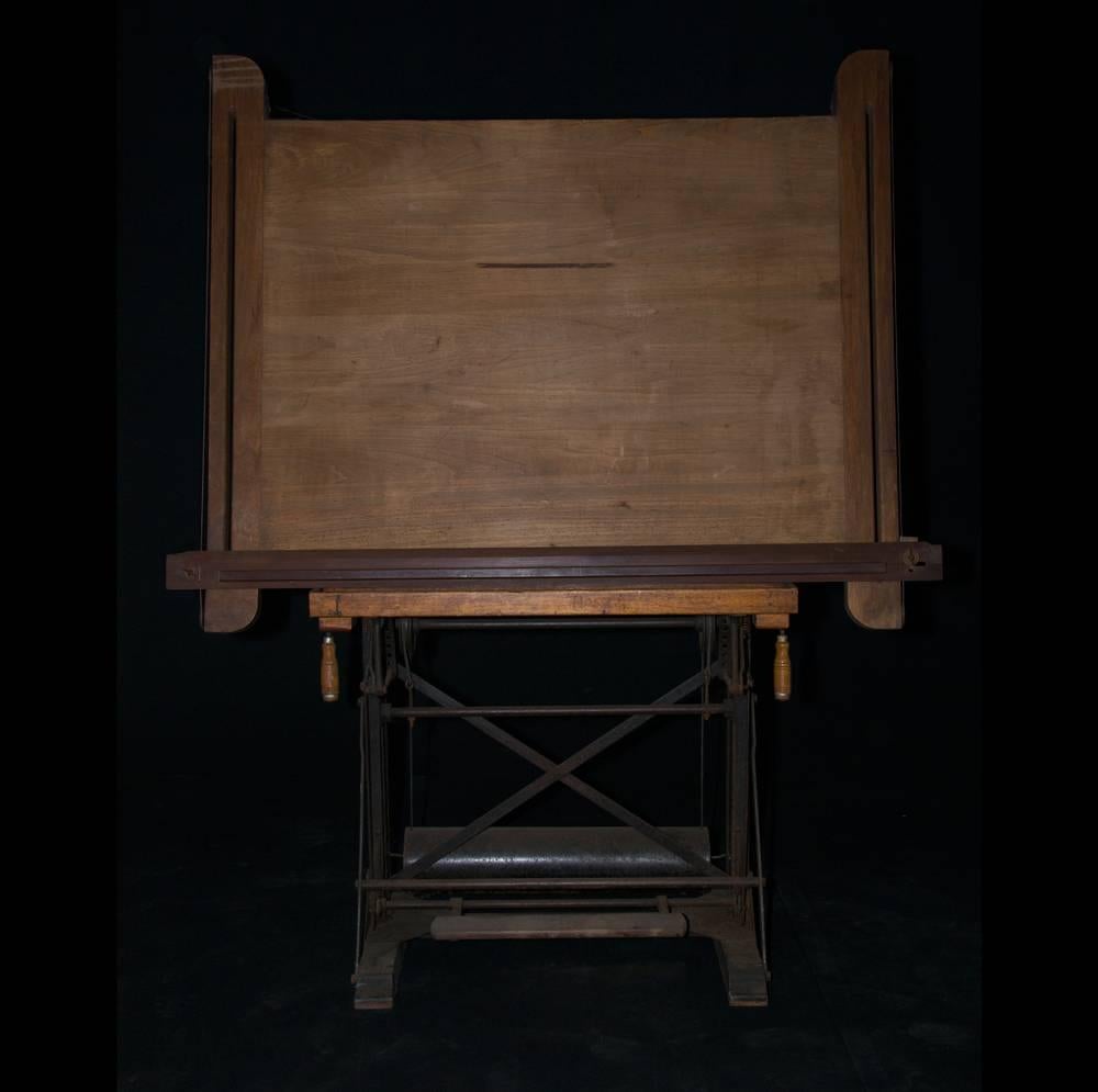 The most complete and original drafting table we have ever had the opportunity to purchase. In perfect vintage condition, with all mechanisms allowing the table to be raised and tilted, with original mechanisms.