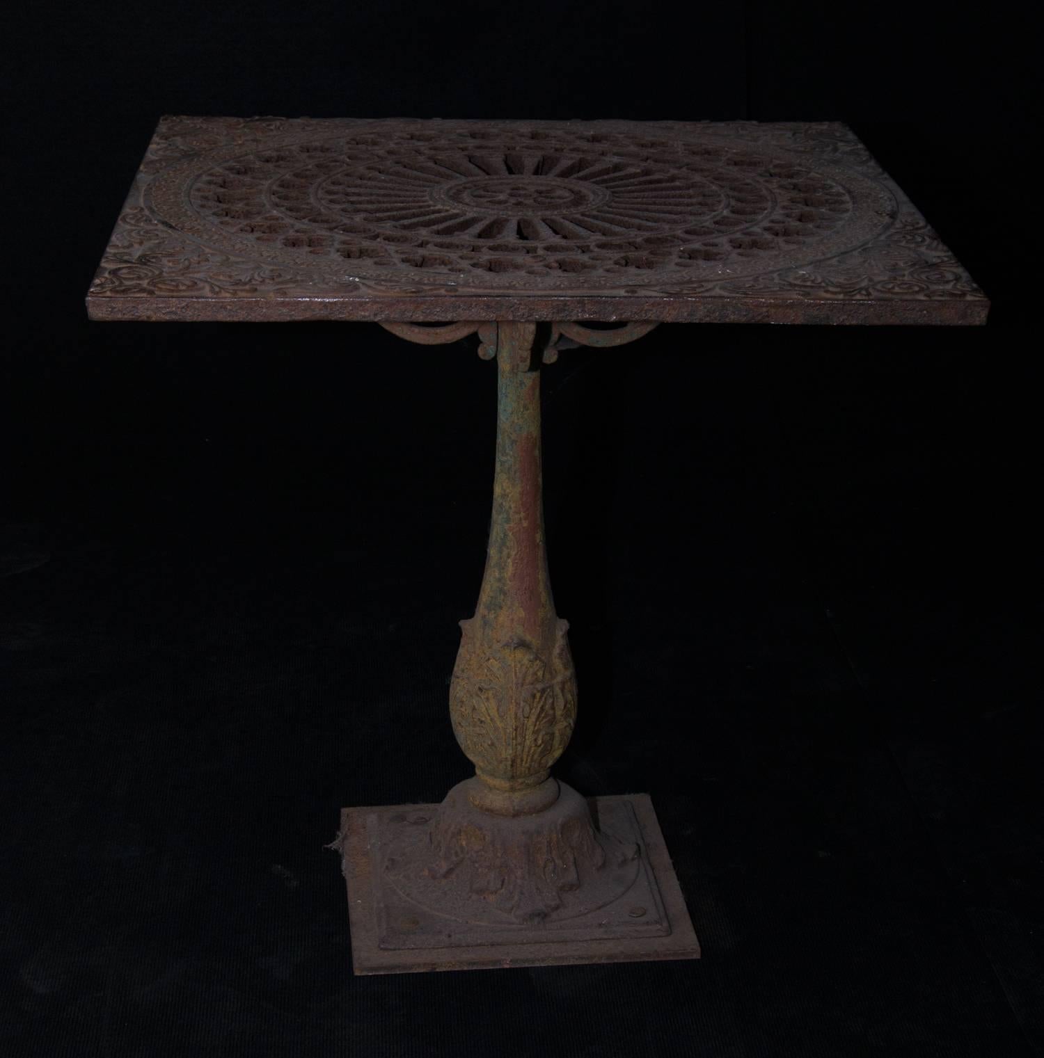 Late 19th century cast iron table with extremely ornate casting of top as well as pedestal. Fabulous original patina, and perfect for indoor or outdoor use.

Measures: 30" L x 30" W x 30" H.

