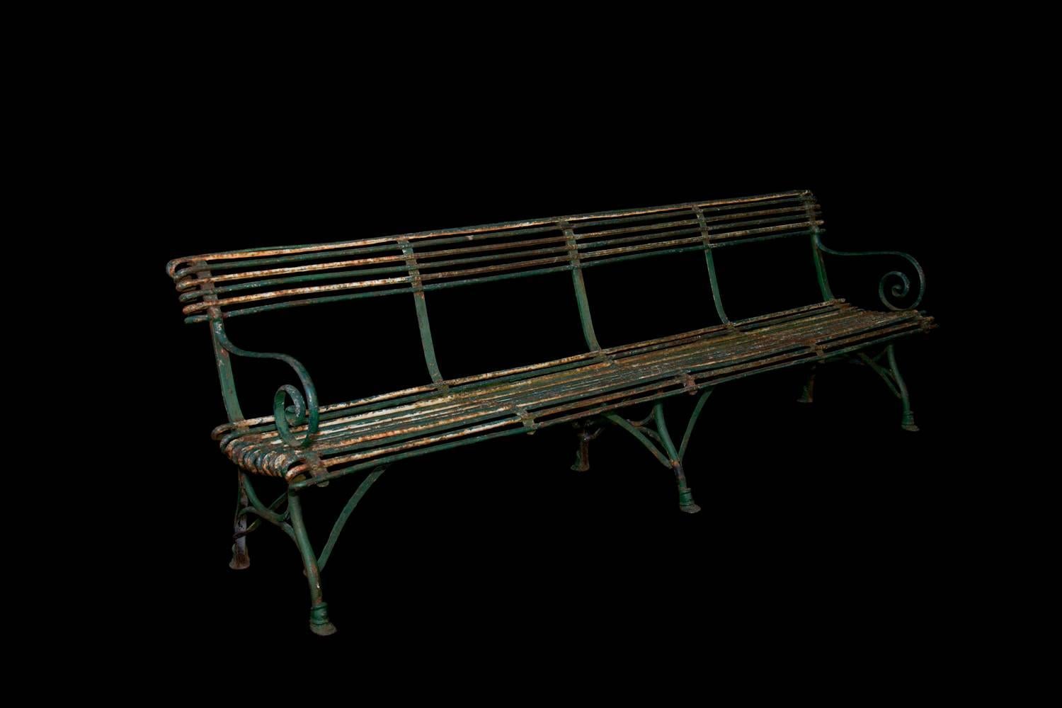 A rare set of antique wrought iron outdoor Arras furniture. Includes an 8 foot bench, two chairs, and freestanding plant shelves. They are manufactured by Arras, makers of furniture found in parks, gardens, castle grounds, cafes and restaurants